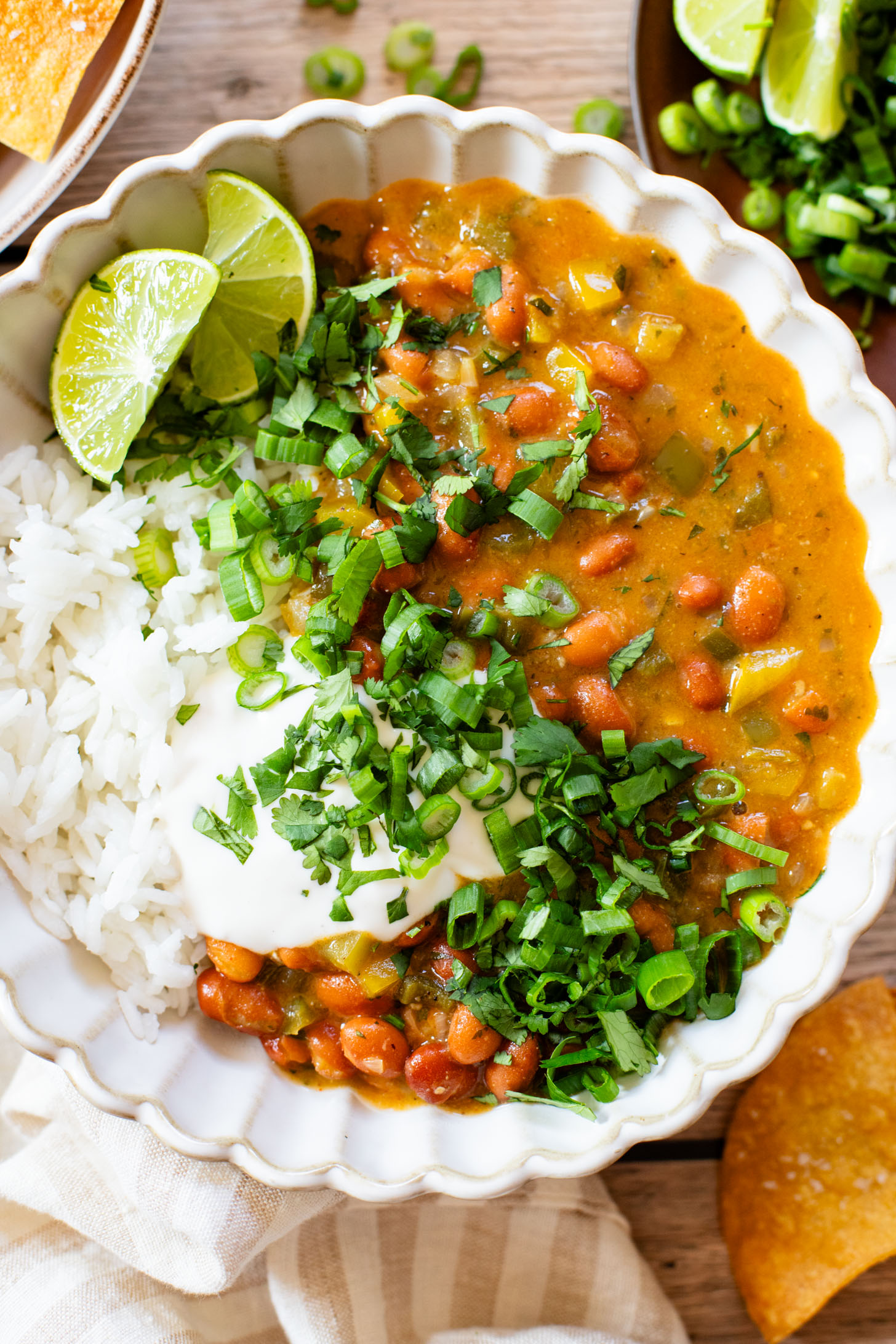 This Creamy Salsa Verde Chili is an easy one-pot weeknight dinner. Served over rice for a complete meal in 30 minutes | ThisSavoryVegan.com