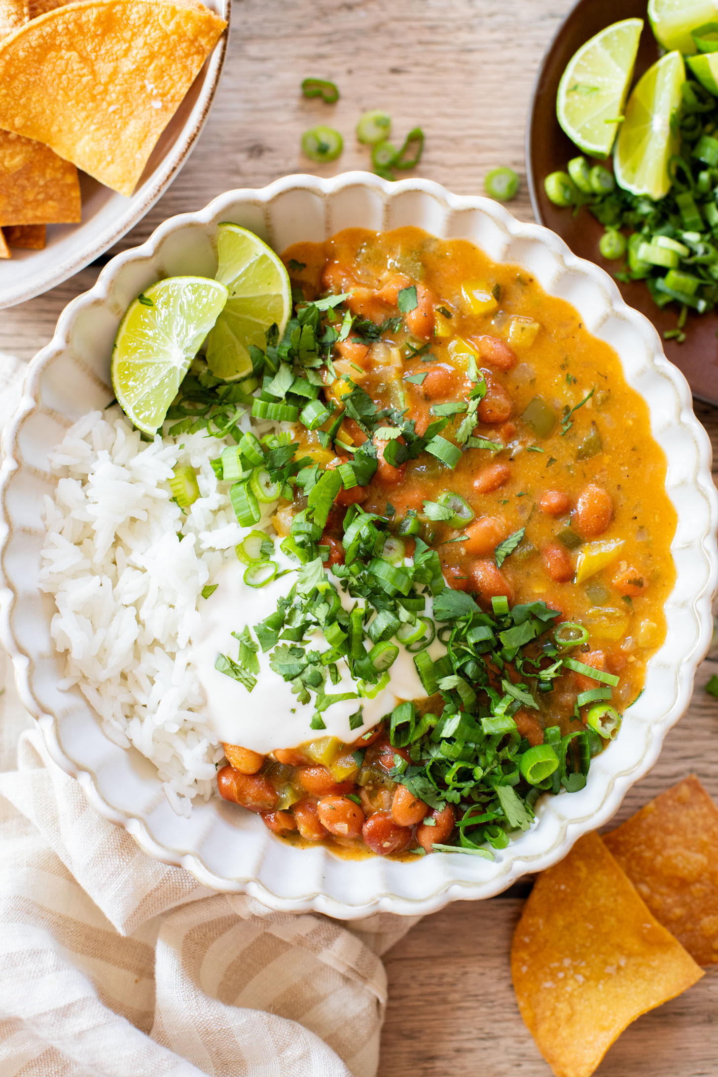 This Creamy Salsa Verde Chili is an easy one-pot weeknight dinner. Served over rice for a complete meal in 30 minutes | ThisSavoryVegan.com