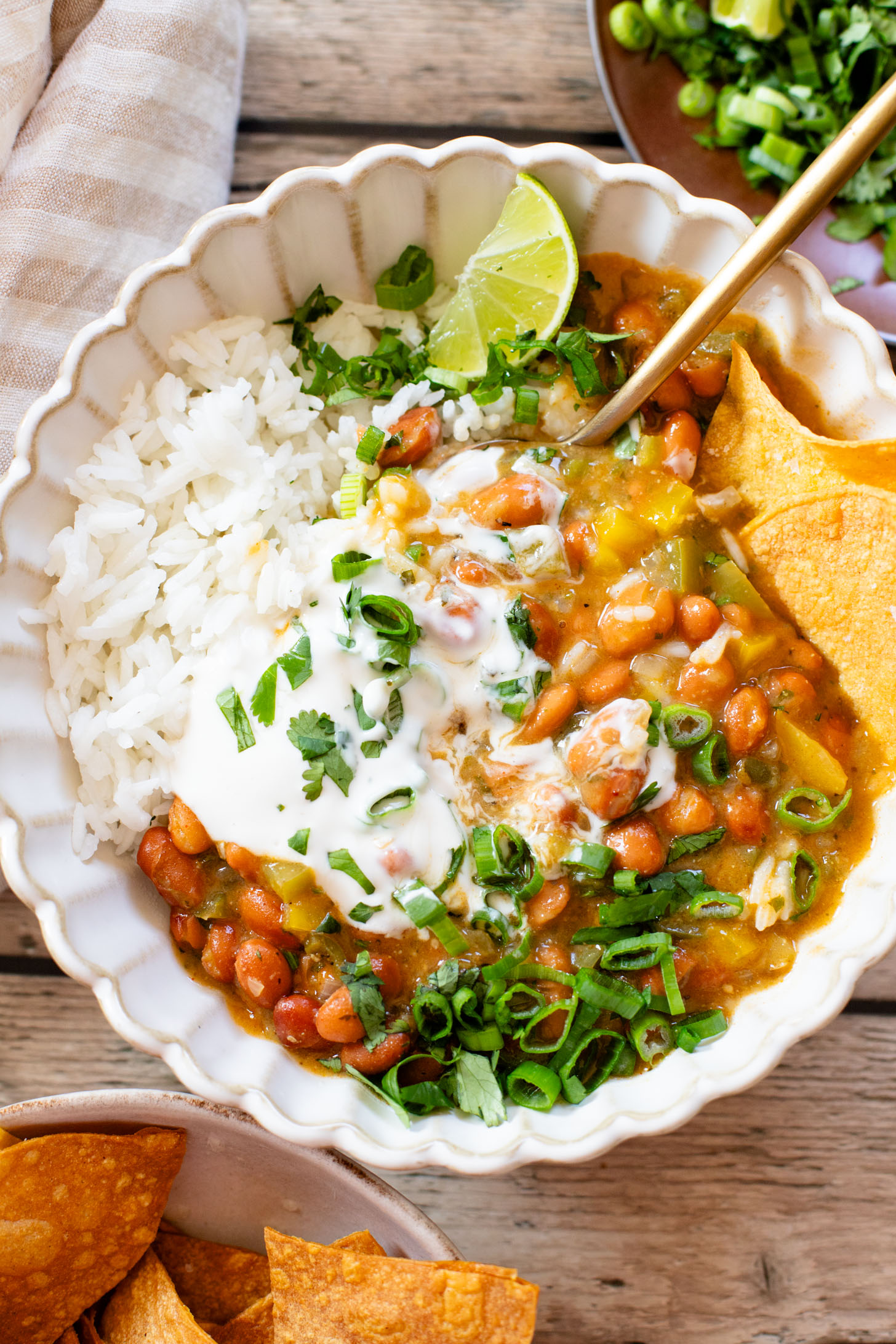This Creamy Salsa Verde Chili is an easy one-pot weeknight dinner. Served over rice for a complete meal in 30 minutes | ThisSavoryVegan.com