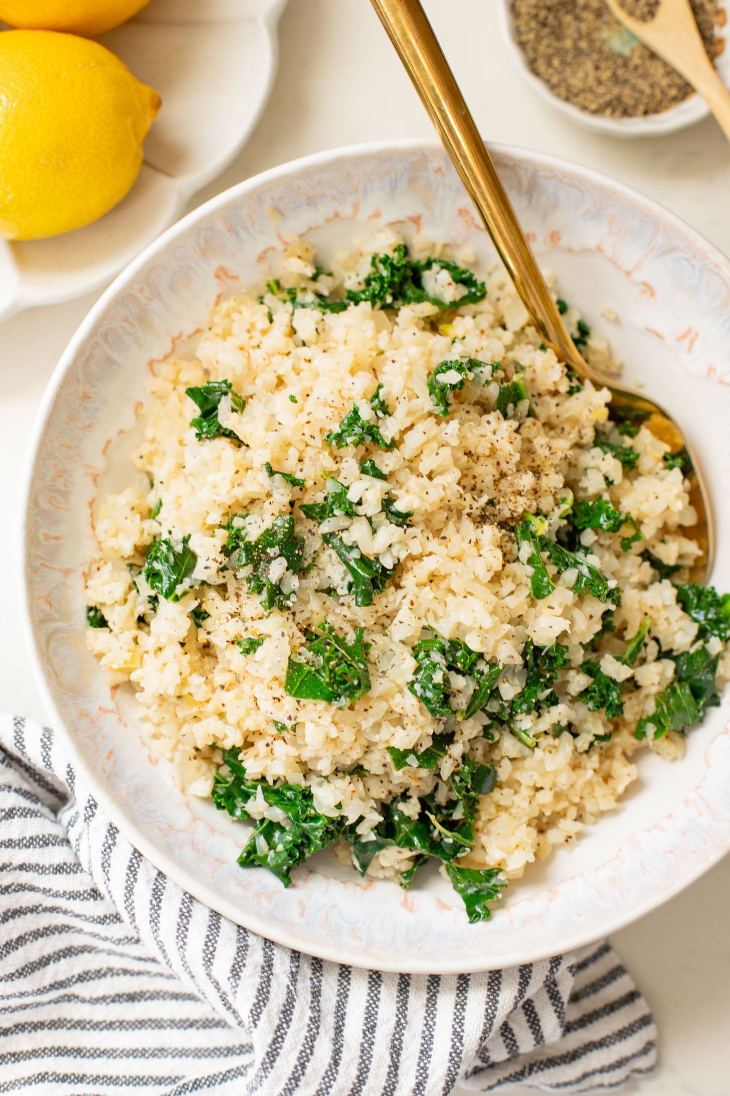 This Garlic Cauliflower Rice with Kale is a low carb rice alternative. The perfect veggie side dish that is packed with flavor | ThisSavoryVegan.com