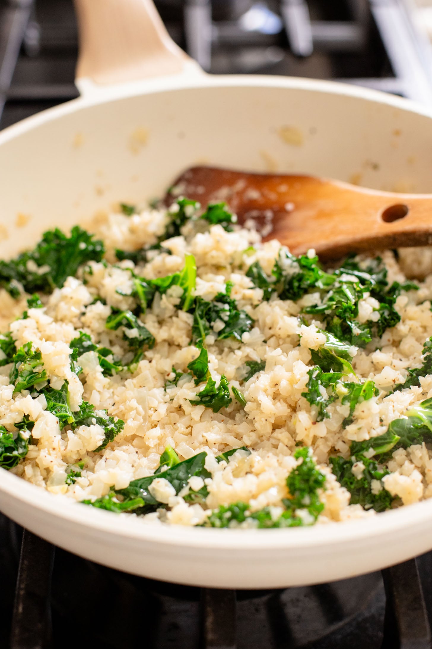 This Garlic Cauliflower Rice with Kale is a low carb rice alternative. The perfect veggie side dish that is packed with flavor | ThisSavoryVegan.com