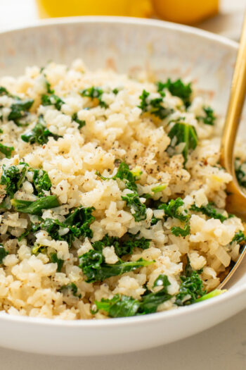 This Garlic Cauliflower Rice with Kale is a low carb rice alternative. The perfect veggie side dish that is packed with flavor | ThisSavoryVegan.com