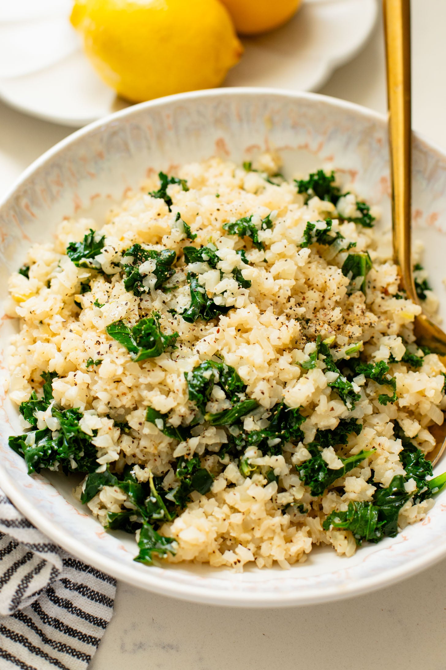 This Garlic Cauliflower Rice with Kale is a low carb rice alternative. The perfect veggie side dish that is packed with flavor | ThisSavoryVegan.com
