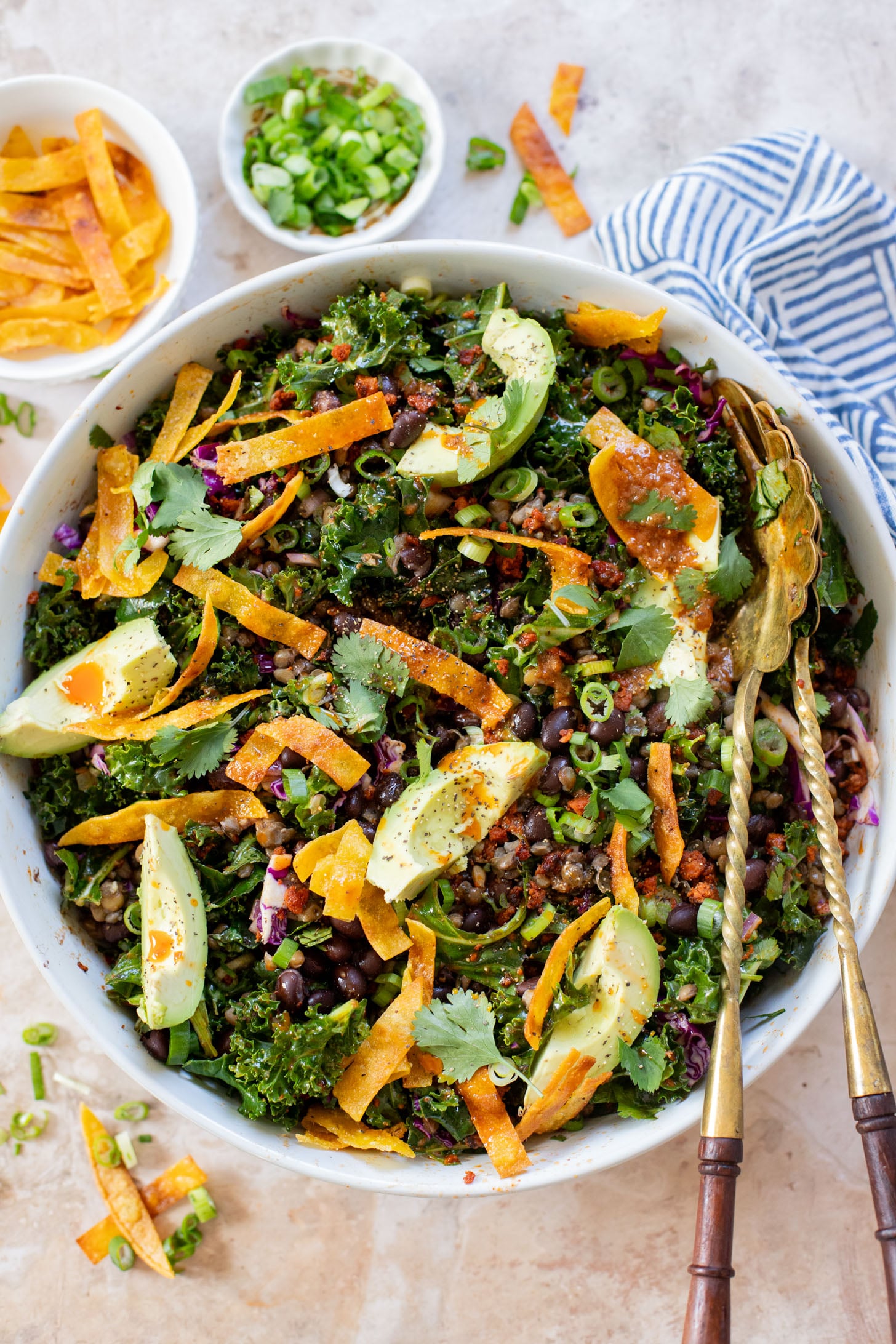 This Lentil & Bean Taco Salad is filled with kale, soy chorizo, greens, lentils & beans. All tossed in a zesty chipotle dressing | ThisSavoryVegan.com