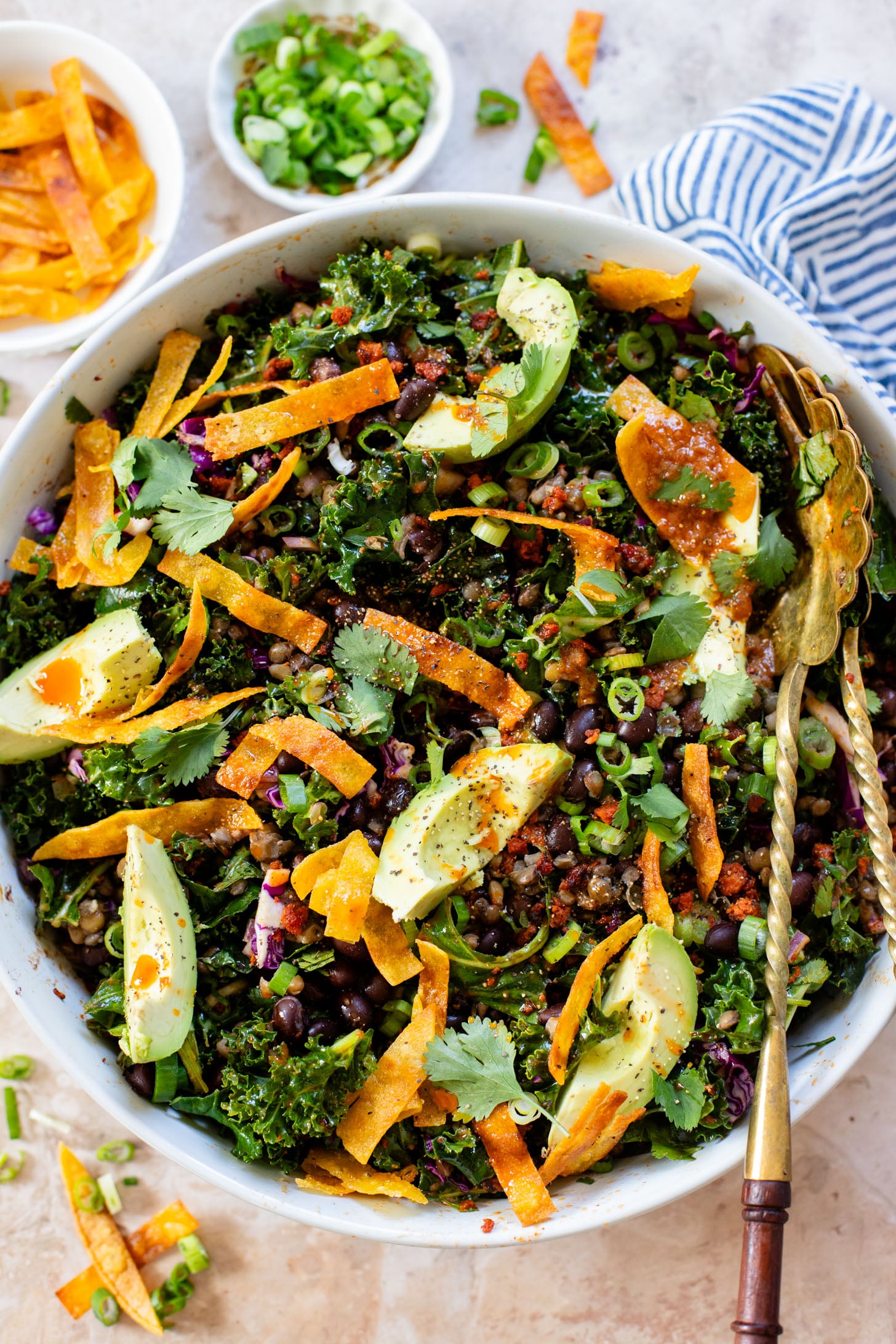 This Lentil & Bean Taco Salad is filled with kale, soy chorizo, greens, lentils & beans. All tossed in a zesty chipotle dressing | ThisSavoryVegan.com