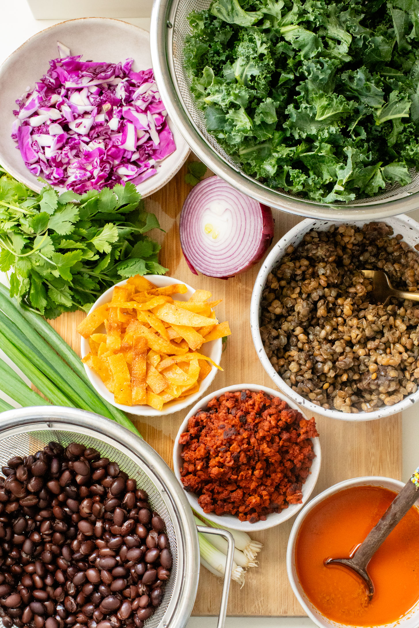 This Lentil & Bean Taco Salad is filled with kale, soy chorizo, greens, lentils & beans. All tossed in a zesty chipotle dressing | ThisSavoryVegan.com