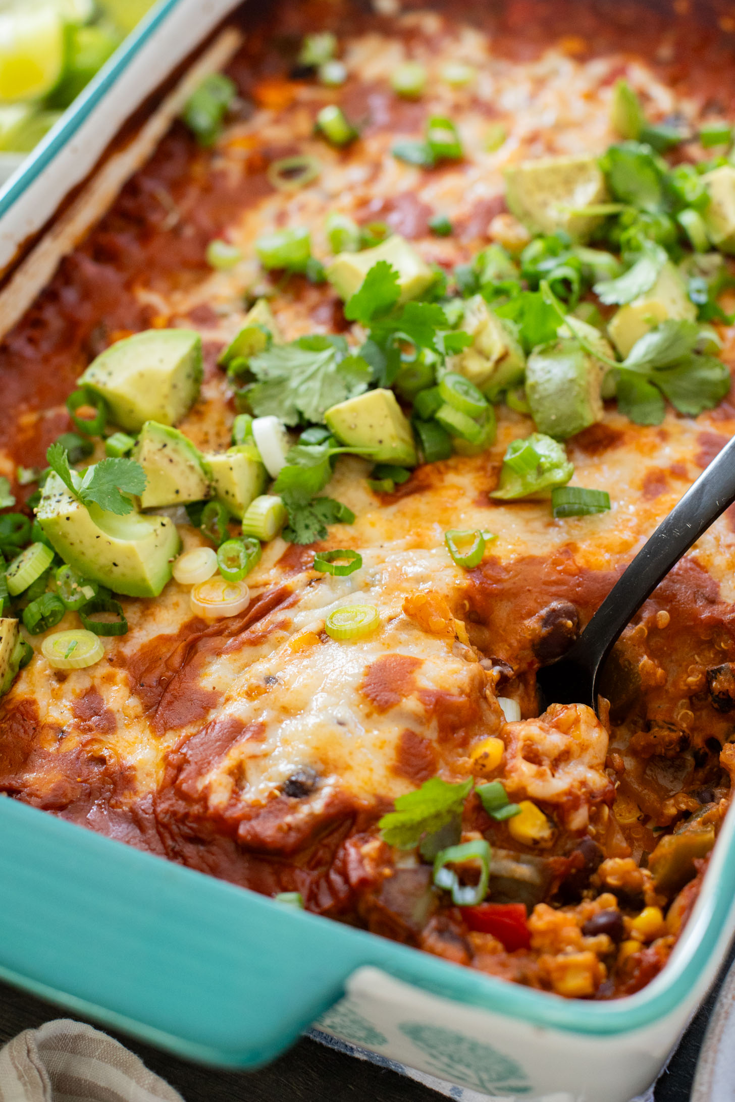 This Quinoa Enchilada Casserole is filled with plant-based protein & veggies. A super easy weeknight dinner that doesn't lack on flavor | ThisSavoryVegan.com