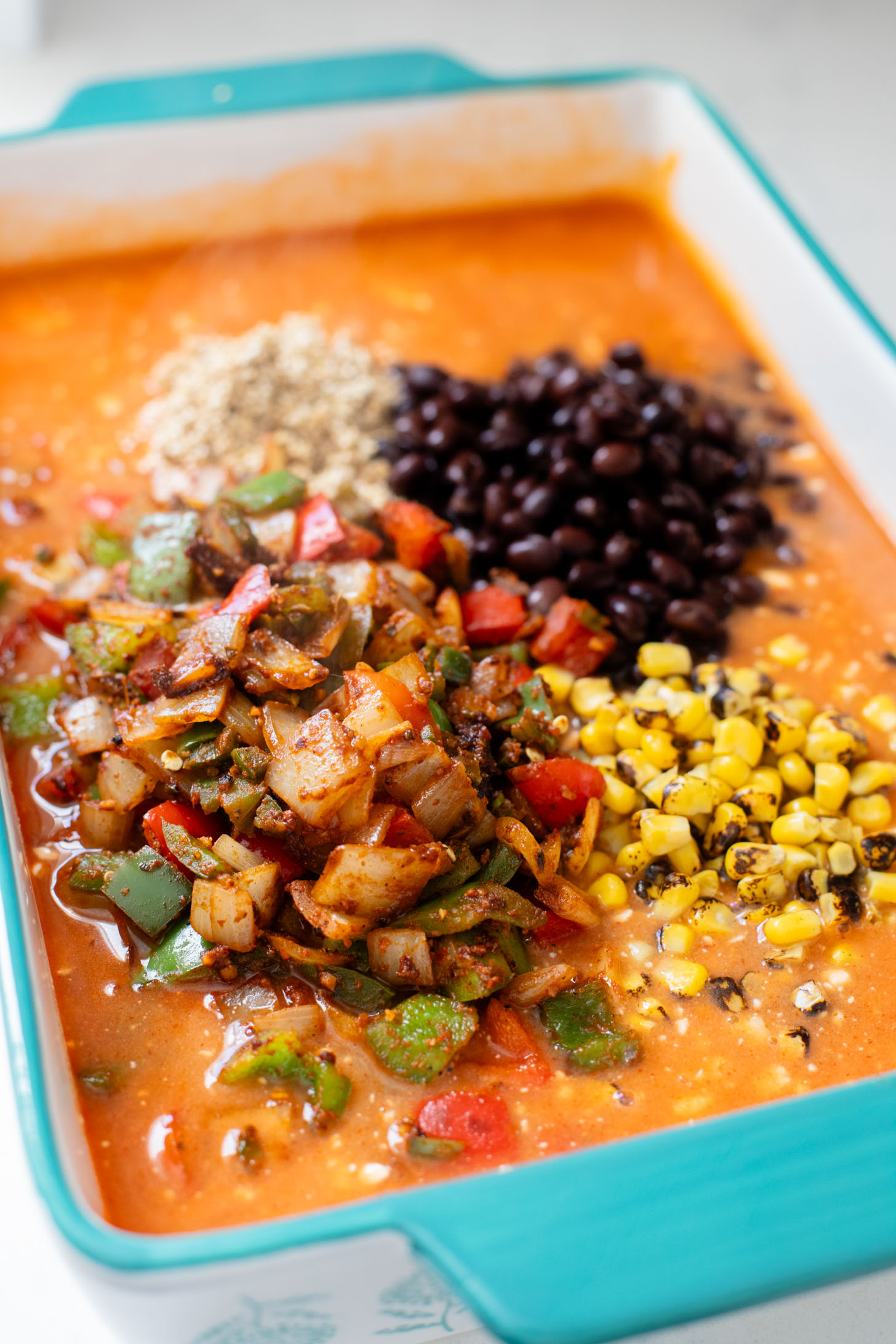 This Quinoa Enchilada Casserole is filled with plant-based protein & veggies. A super easy weeknight dinner that doesn't lack on flavor | ThisSavoryVegan.com