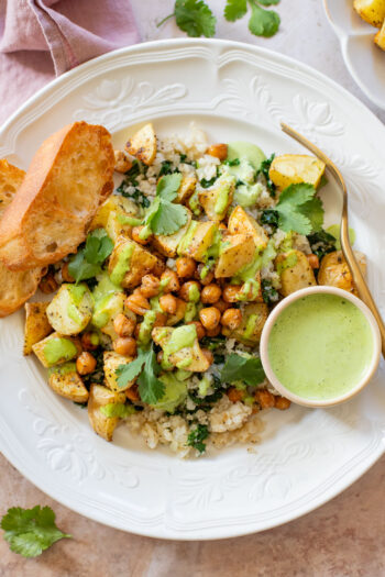 These Roasted Potato & Chickpea Bowls are a simple vegan dinner! Served over cauliflower rice with a dairy-free jalapeño ranch | ThisSavoryVegan.com