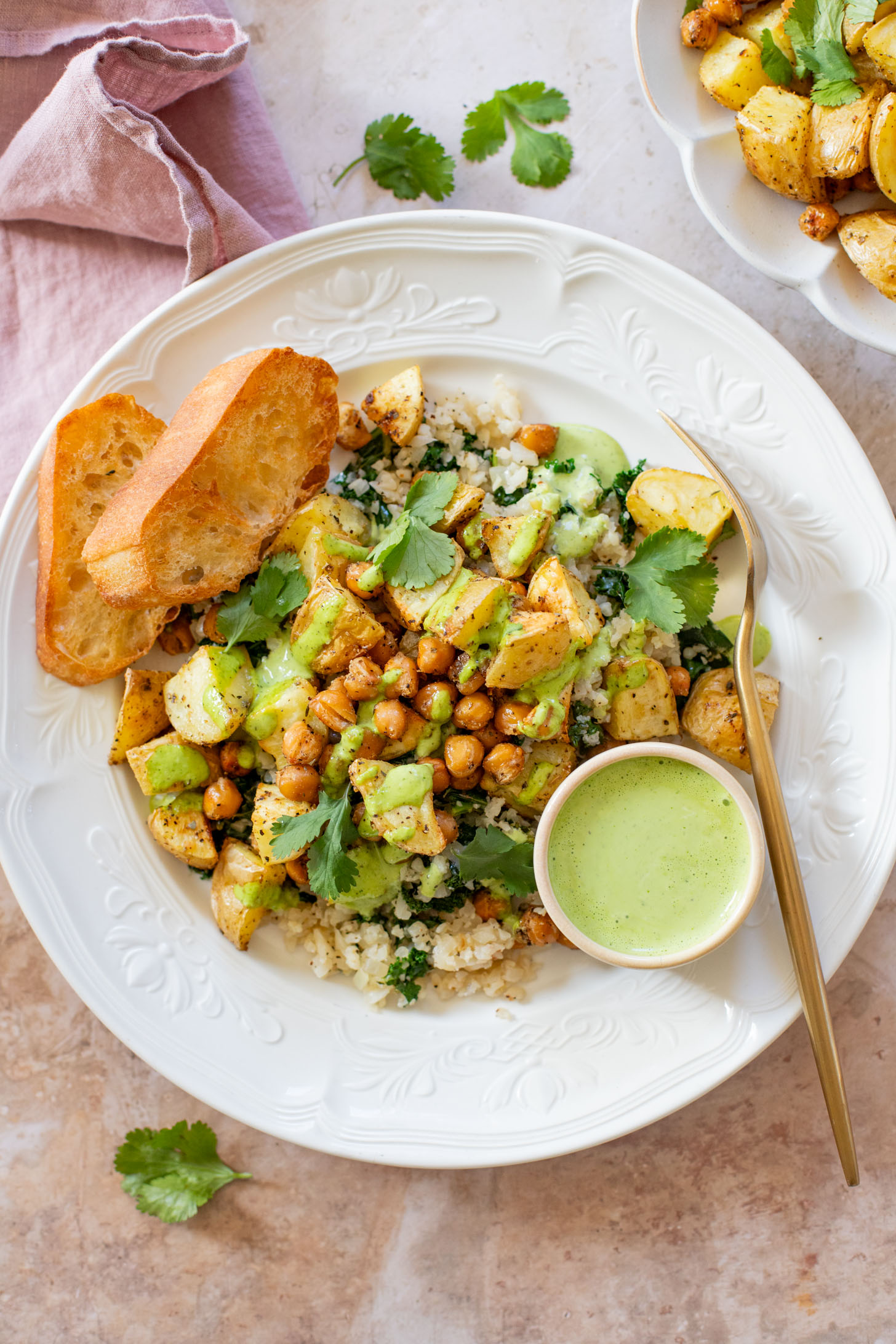 These Roasted Potato & Chickpea Bowls are a simple vegan dinner! Served over cauliflower rice with a dairy-free jalapeño ranch | ThisSavoryVegan.com