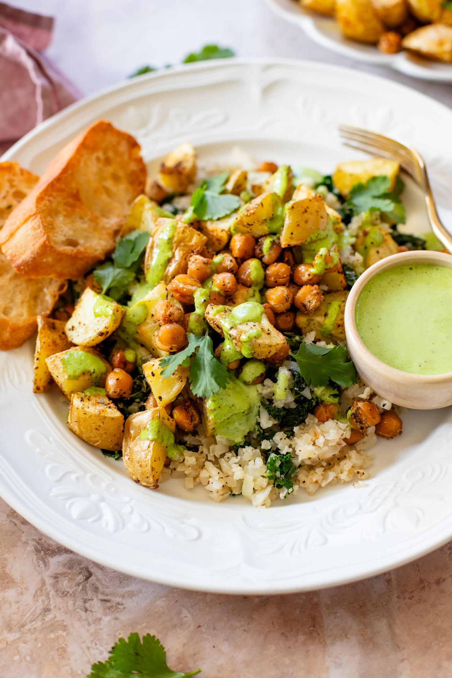 These Roasted Potato & Chickpea Bowls are a simple vegan dinner! Served over cauliflower rice with a dairy-free jalapeño ranch | ThisSavoryVegan.com