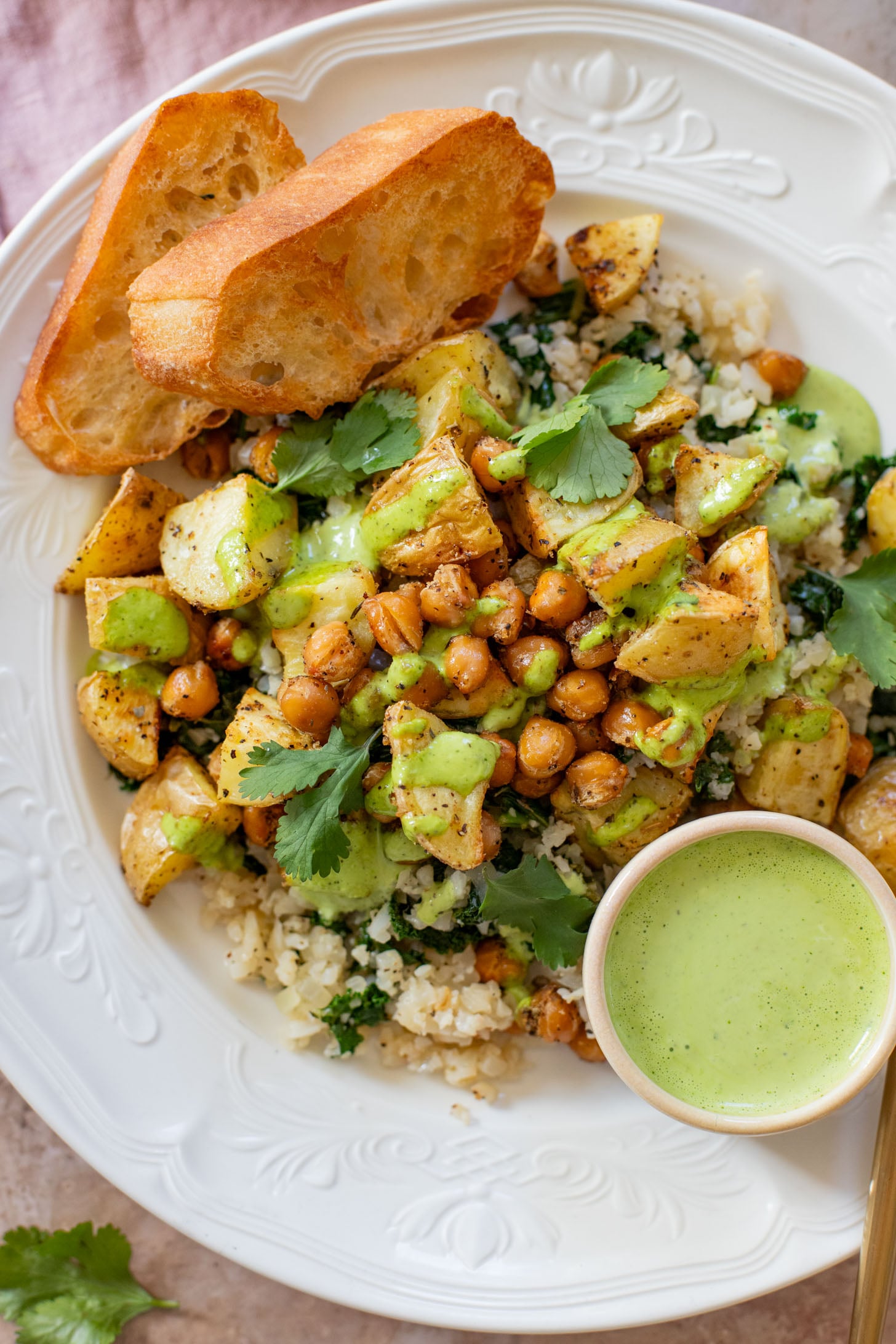These Roasted Potato & Chickpea Bowls are a simple vegan dinner! Served over cauliflower rice with a dairy-free jalapeño ranch | ThisSavoryVegan.com