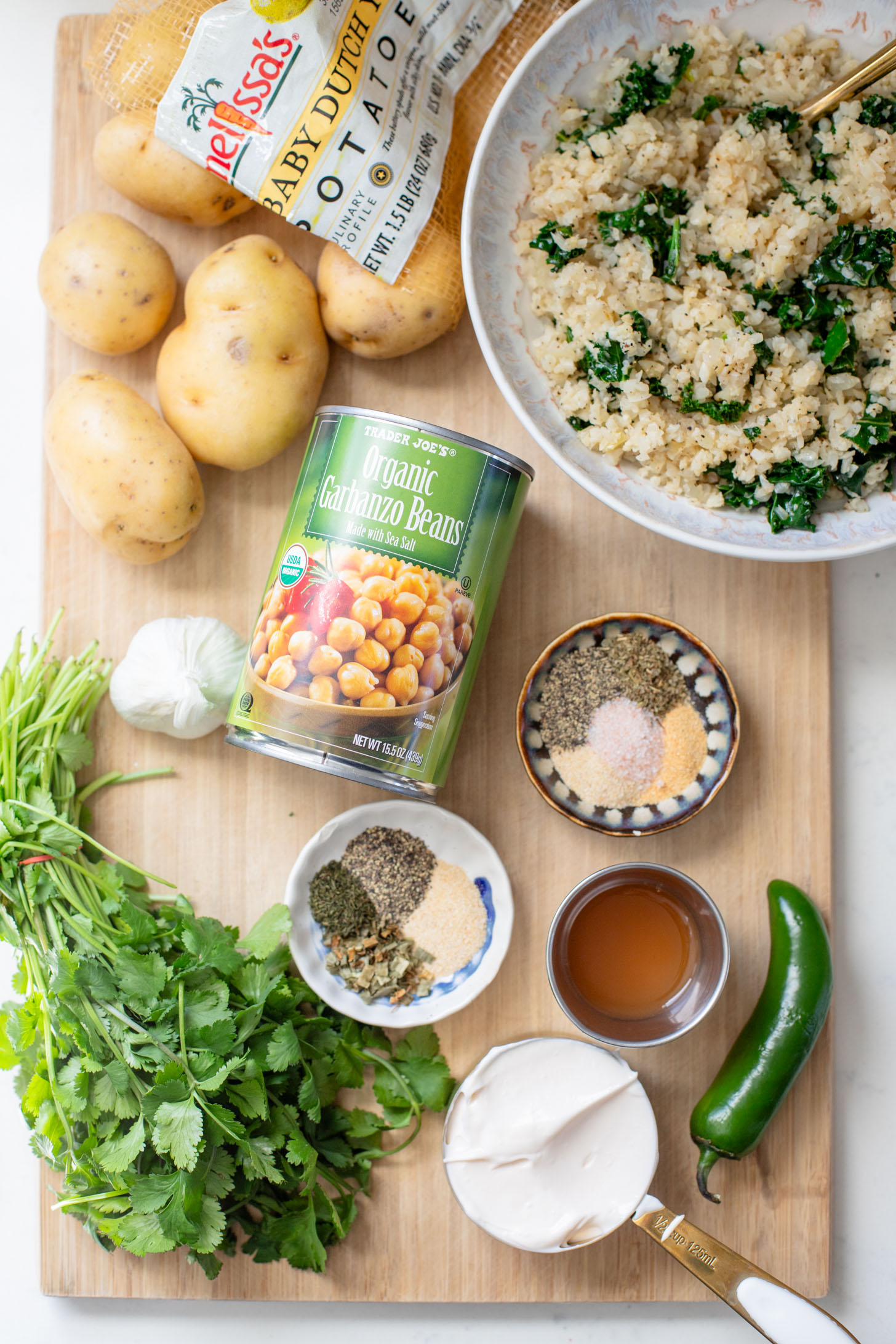 These Roasted Potato & Chickpea Bowls are a simple vegan dinner! Served over cauliflower rice with a dairy-free jalapeño ranch | ThisSavoryVegan.com