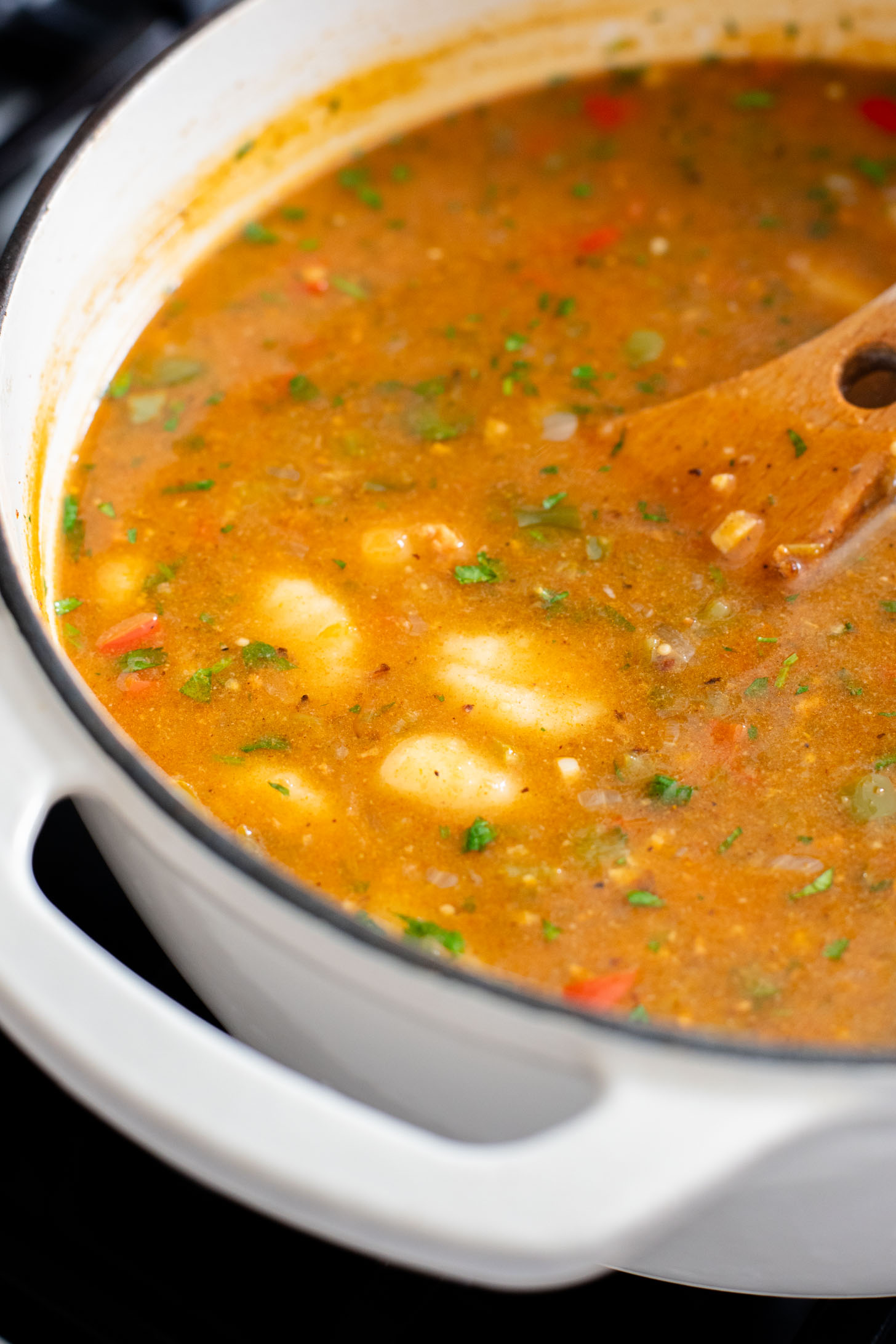 Comforting & cozy, this Salsa Verde Gnocchi Soup is packed with veggies, soy chorizo and tender gnocchi. Plant-based & delicious | ThisSavoryVegan.com