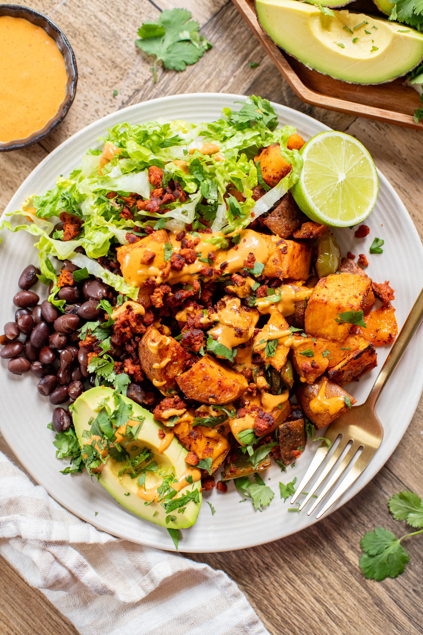 This Smoky Sweet Potatoes & Beans recipe is super versatile. Serve it as an easy sheet pan dinner or savory vegan brunch | ThisSavoryVegan.com