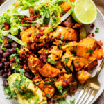 This Smoky Sweet Potatoes & Beans recipe is super versatile. Serve it as an easy sheet pan dinner or savory vegan brunch | ThisSavoryVegan.com