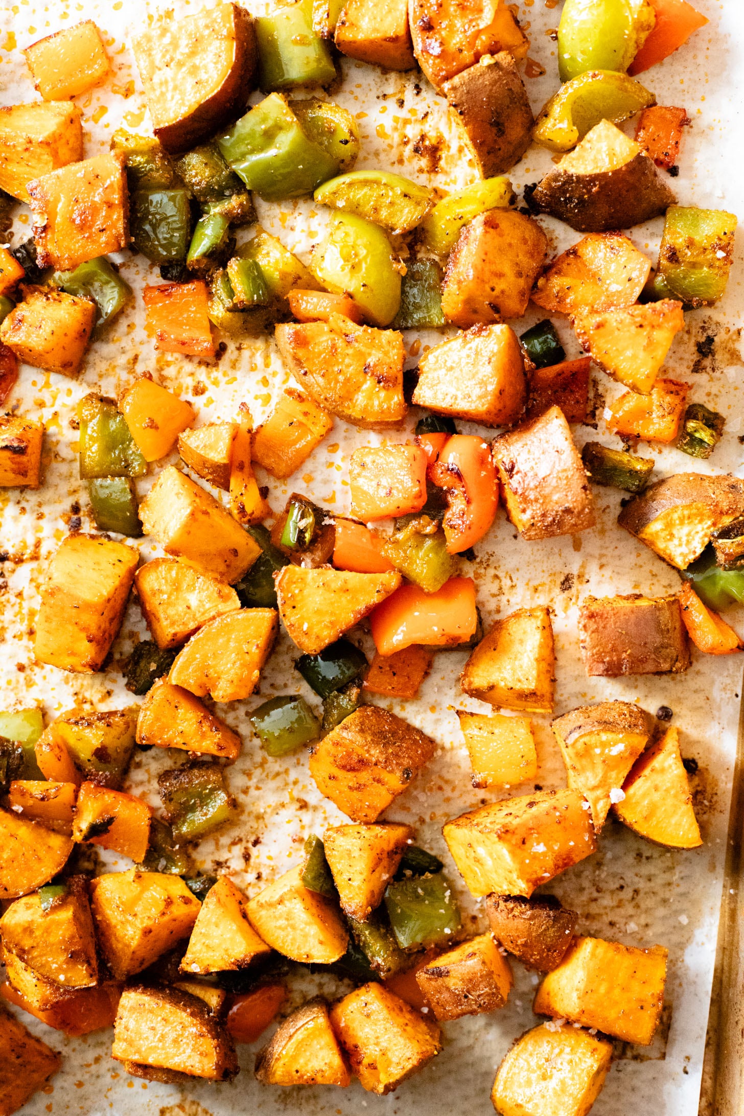 This Smoky Sweet Potatoes & Beans recipe is super versatile. Serve it as an easy sheet pan dinner or savory vegan brunch | ThisSavoryVegan.com