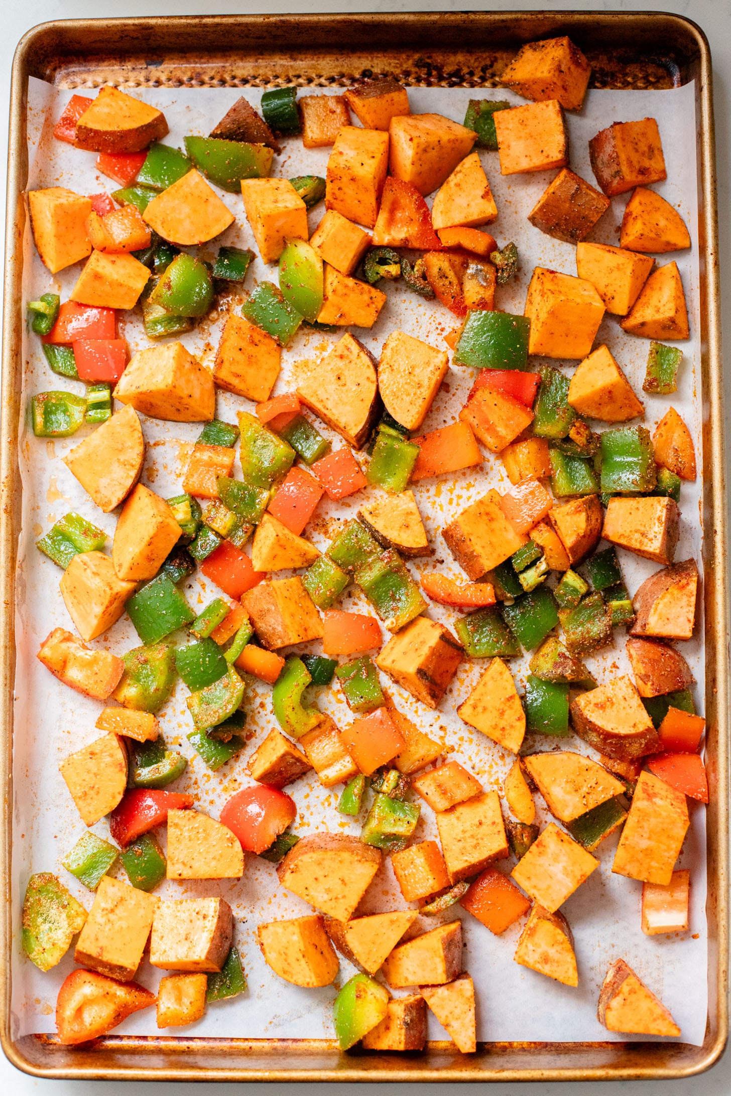 This Smoky Sweet Potatoes & Beans recipe is super versatile. Serve it as an easy sheet pan dinner or savory vegan brunch | ThisSavoryVegan.com