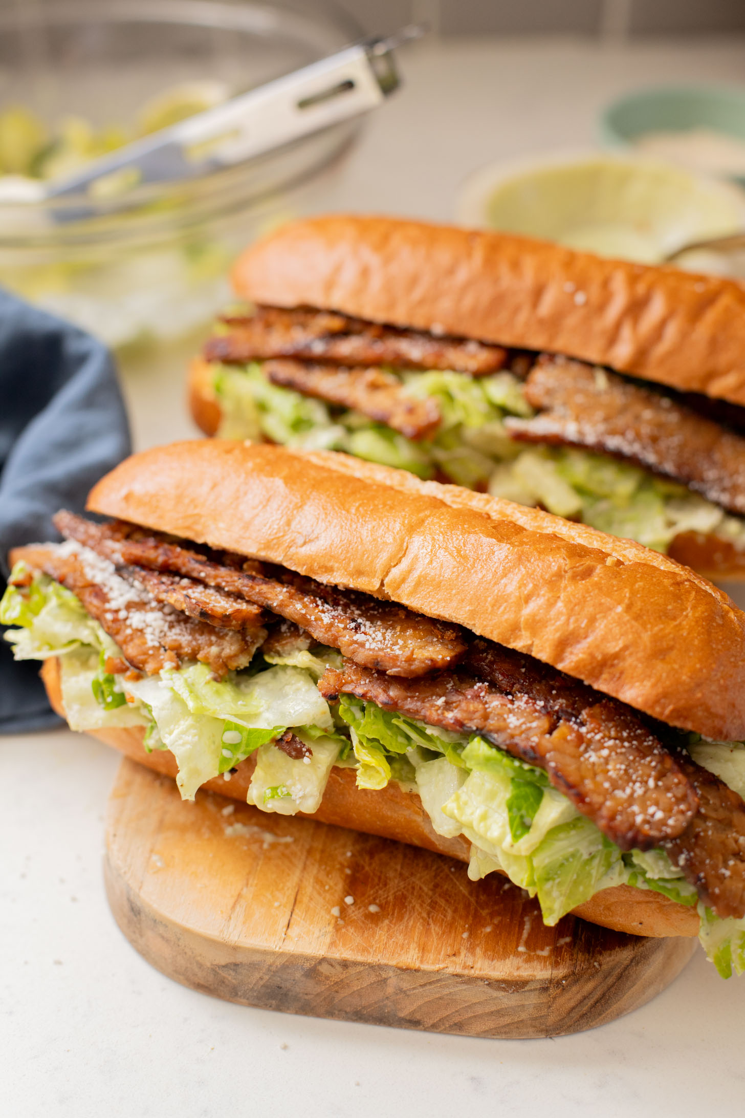 These Tempeh Bacon Caesar Salad Sandwiches have everything you could want in a vegan sandwich! So delicious & super easy | ThisSavoryVegan.com