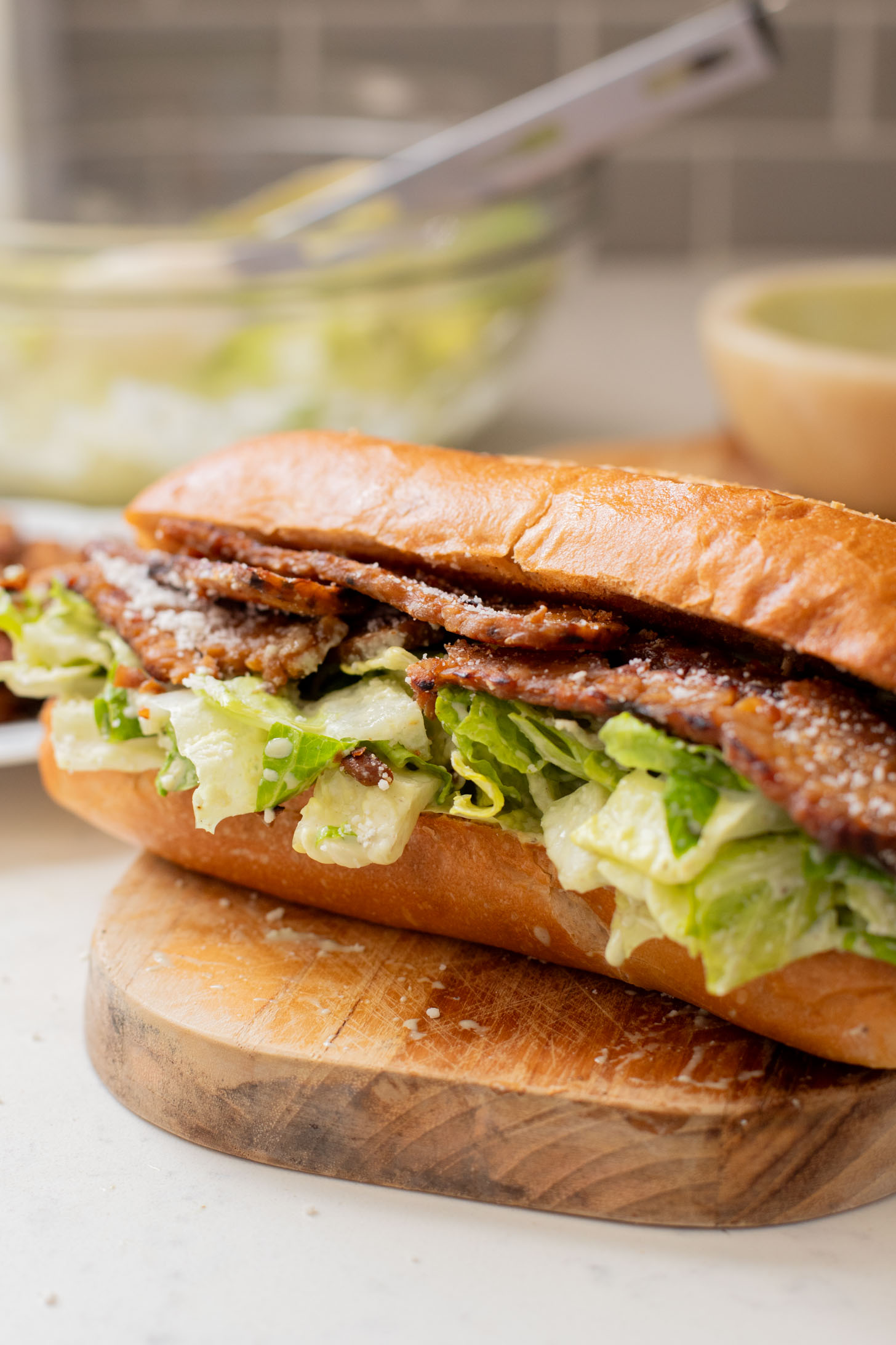 These Tempeh Bacon Caesar Salad Sandwiches have everything you could want in a vegan sandwich! So delicious & super easy | ThisSavoryVegan.com