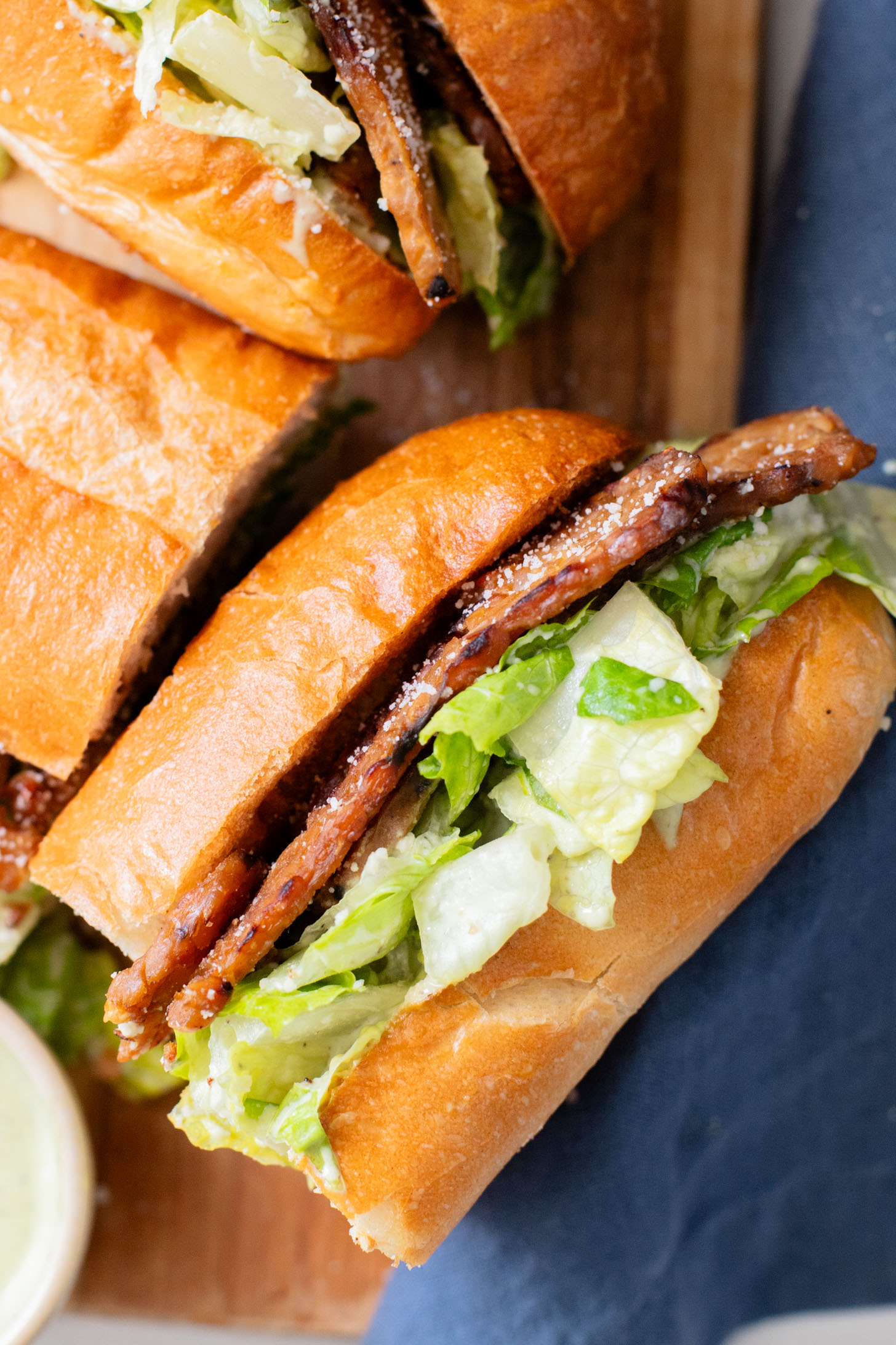 These Tempeh Bacon Caesar Salad Sandwiches have everything you could want in a vegan sandwich! So delicious & super easy | ThisSavoryVegan.com