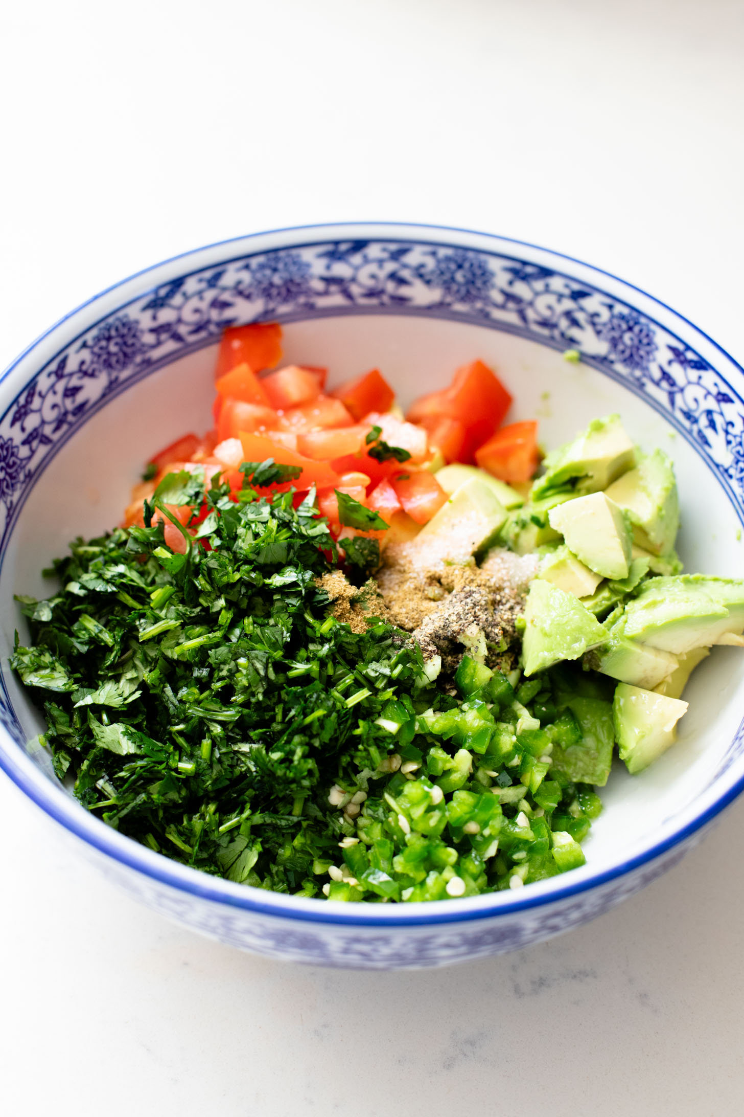 These Tofu Fajita Rice Bowls are a quick sheet pan dinner recipe! Packed with protein & veggies, and topped with avocado salsa | ThisSavoryVegan.com