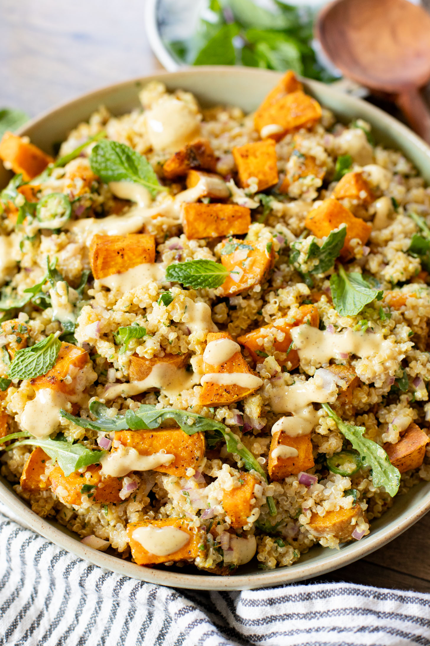 This Ginger & Herb Sweet Potato Quinoa Salad is a flavor bomb! Roasted sweet potatoes, tender quinoa, fresh herbs and the best ginger dressing | ThisSavoryVegan.com