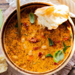 This Vegan White Bean & Sausage Soup is a creamy, hearty soup recipe that is cozy & perfect for serving a family | ThisSavoryVegan.com