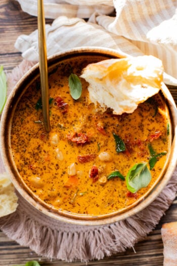 This Vegan White Bean & Sausage Soup is a creamy, hearty soup recipe that is cozy & perfect for serving a family | ThisSavoryVegan.com