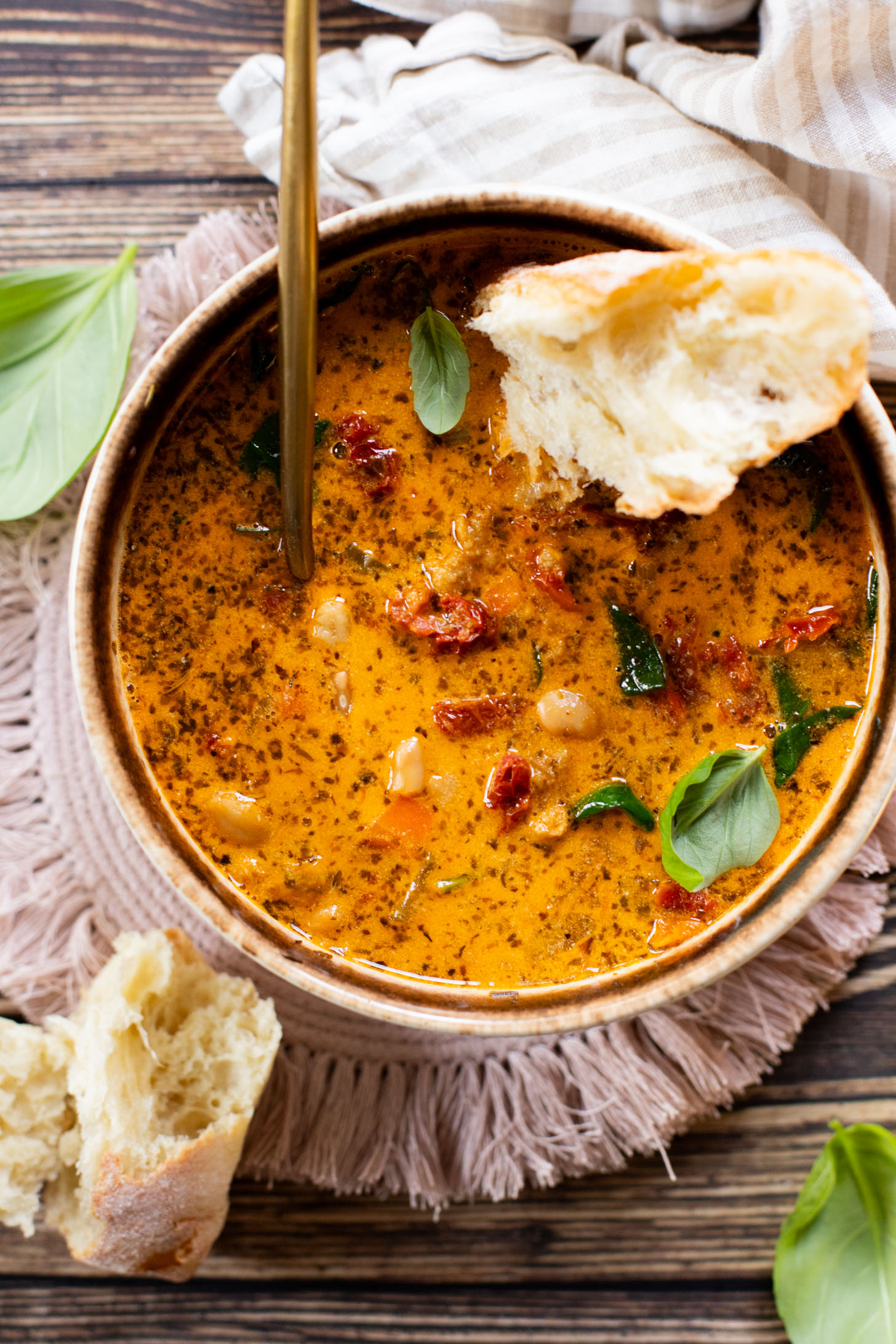 This Vegan White Bean & Sausage Soup is a creamy, hearty soup recipe that is cozy & perfect for serving a family | ThisSavoryVegan.com