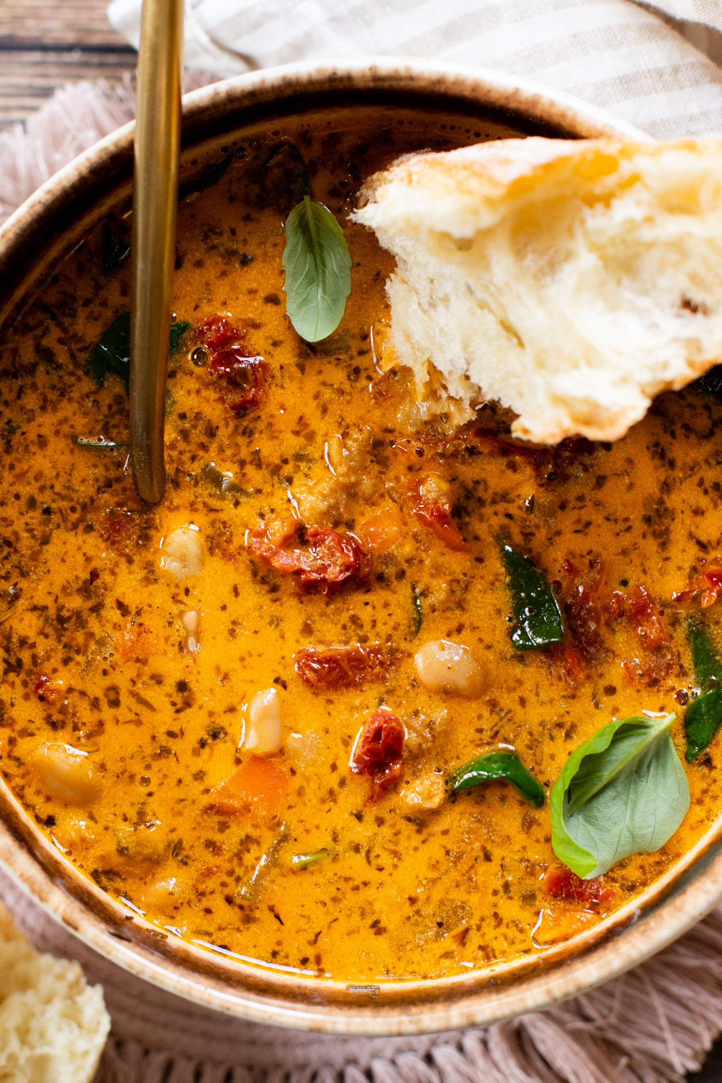This Vegan White Bean & Sausage Soup is a creamy, hearty soup recipe that is cozy & perfect for serving a family | ThisSavoryVegan.com