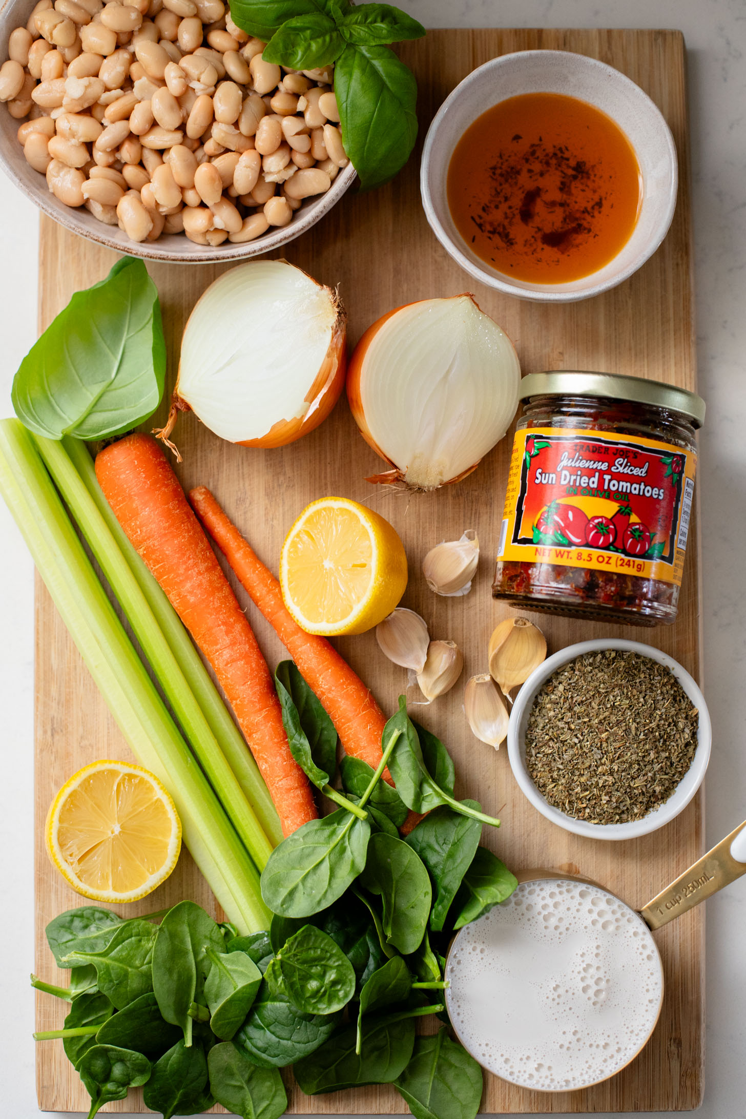 This Vegan White Bean & Sausage Soup is a creamy, hearty soup recipe that is cozy & perfect for serving a family | ThisSavoryVegan.com