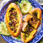 These Baked Vegan Egg Boats are filled with Just egg, pesto, sun-dried tomatoes & tempeh bacon. Perfect for a vegan brunch | ThisSavoryVegan.com