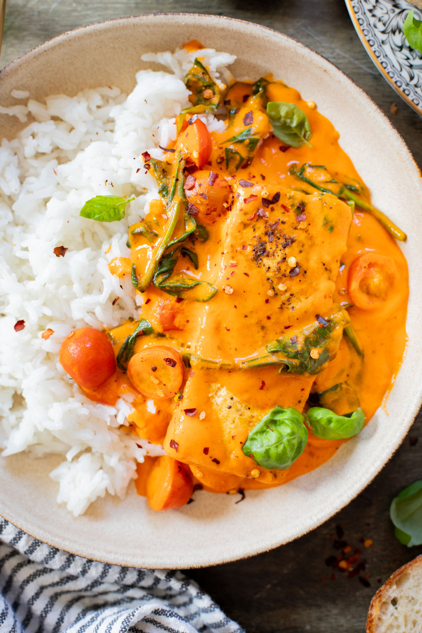 This Crispy Tofu in Roasted Red Pepper Sauce is a one-pot dinner that includes a delicious creamy sauce, tofu filets and greens | ThisSavoryVegan.com