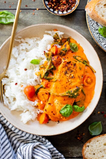 This Crispy Tofu in Roasted Red Pepper Sauce is a one-pot dinner that includes a delicious creamy sauce, tofu filets and greens | ThisSavoryVegan.com
