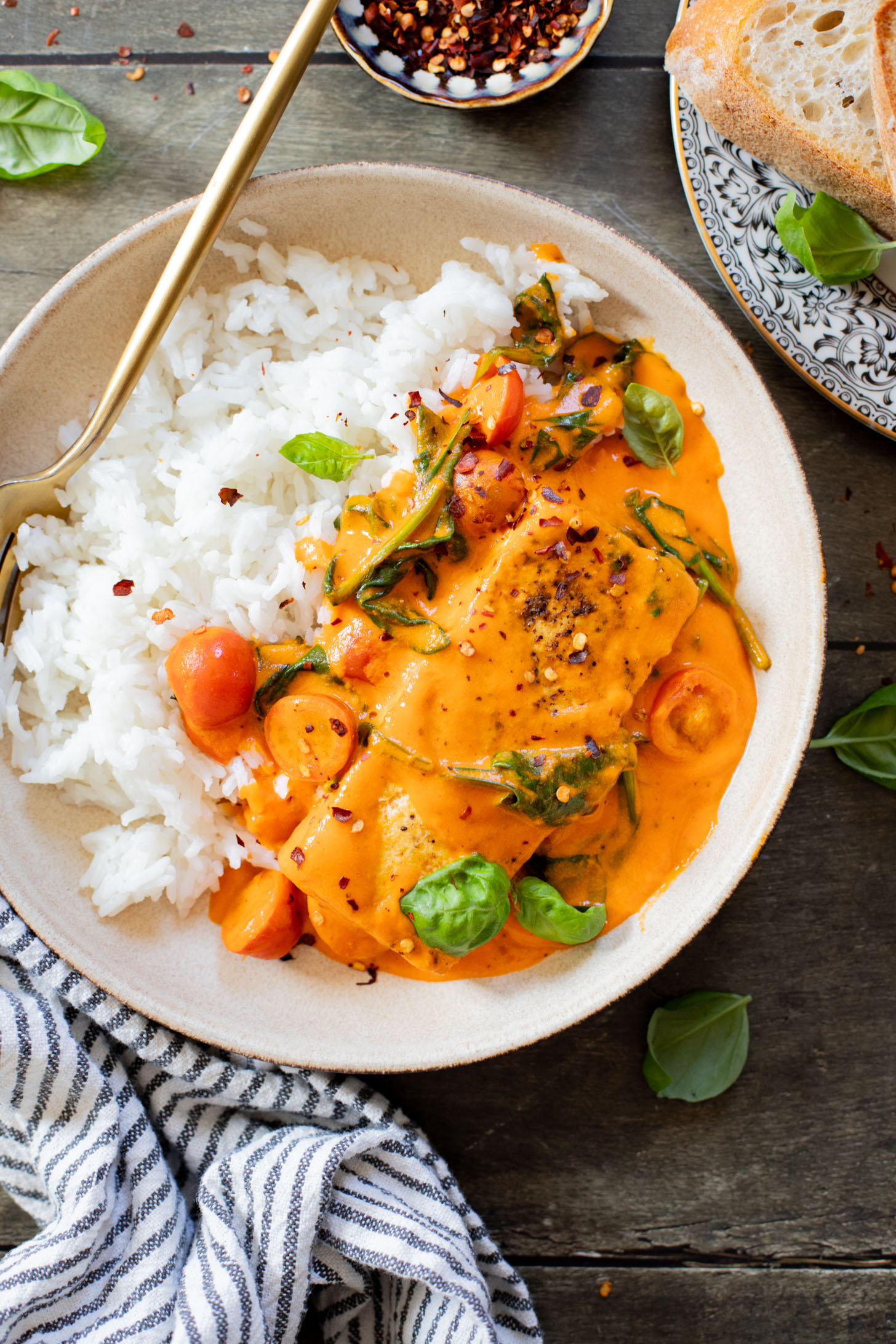 This Crispy Tofu in Roasted Red Pepper Sauce is a one-pot dinner that includes a delicious creamy sauce, tofu filets and greens | ThisSavoryVegan.com