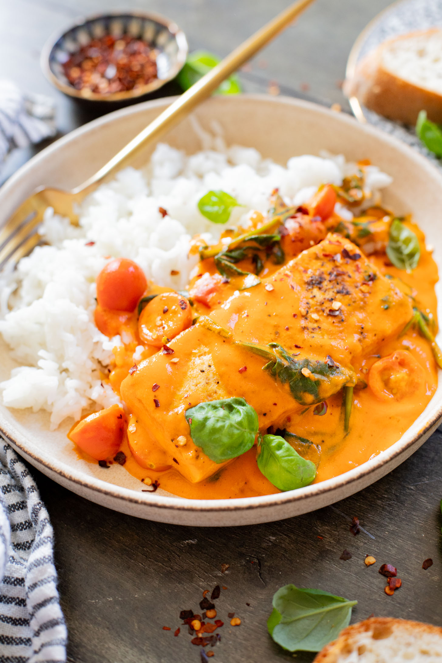 This Crispy Tofu in Roasted Red Pepper Sauce is a one-pot dinner that includes a delicious creamy sauce, tofu filets and greens | ThisSavoryVegan.com