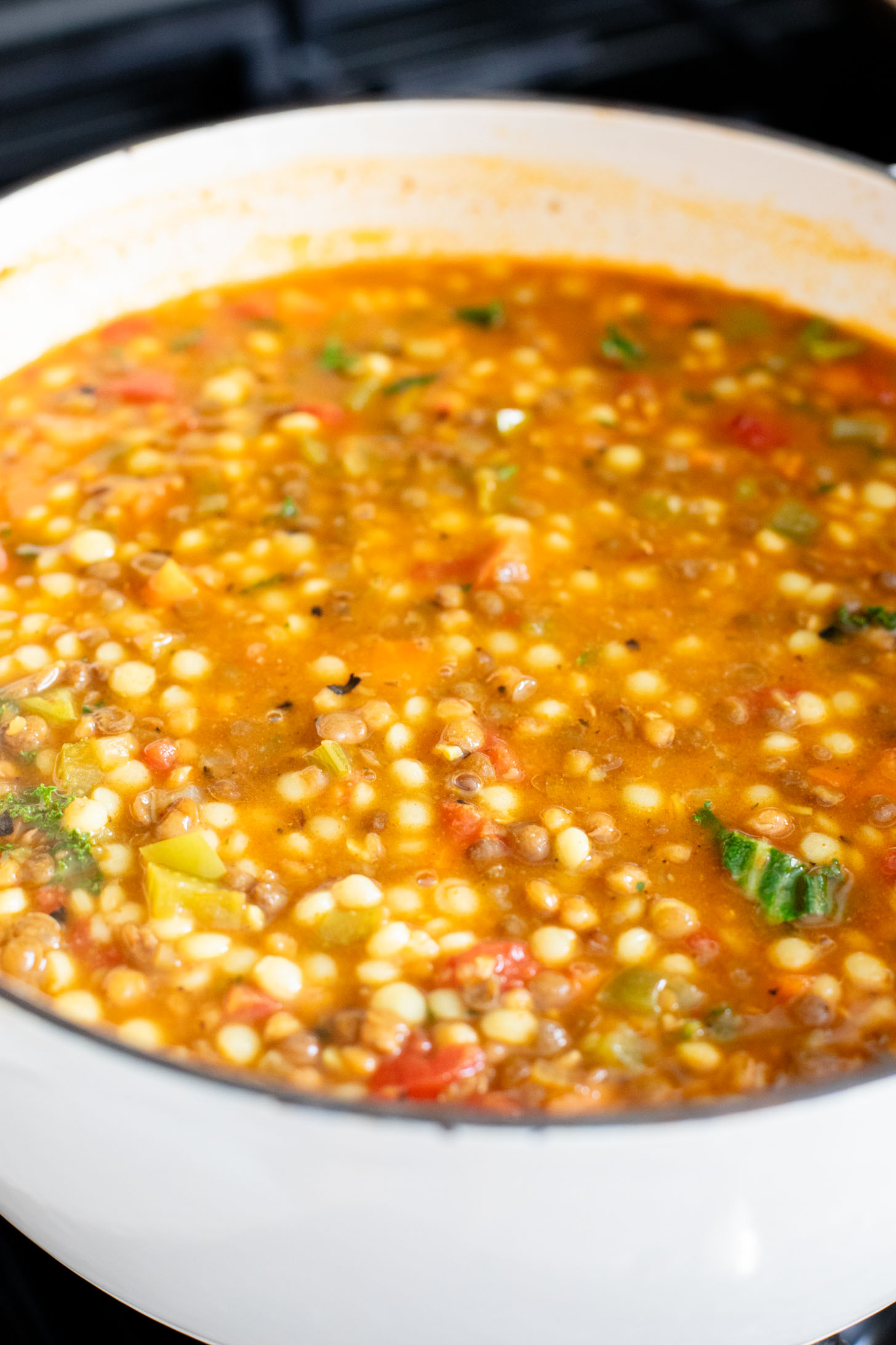 This Lentil & Couscous Soup is simple & veggie-packed! Ready in less than an hour and perfect for a cozy night at home | ThisSavoryVegan.com