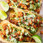 These Quick Chickpea Tacos are a weeknight staple! Made with a cilantro jalapeño slaw & super tasty chickpeas | ThisSavoryVegan.com