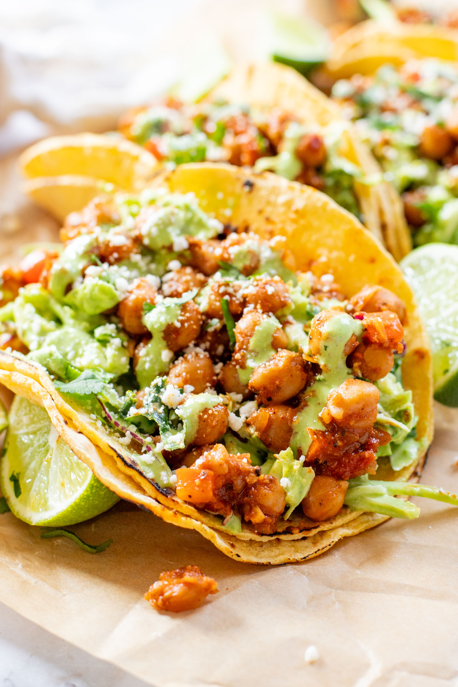 These Quick Chickpea Tacos are a weeknight staple! Made with a cilantro jalapeño slaw & super tasty chickpeas | ThisSavoryVegan.com
