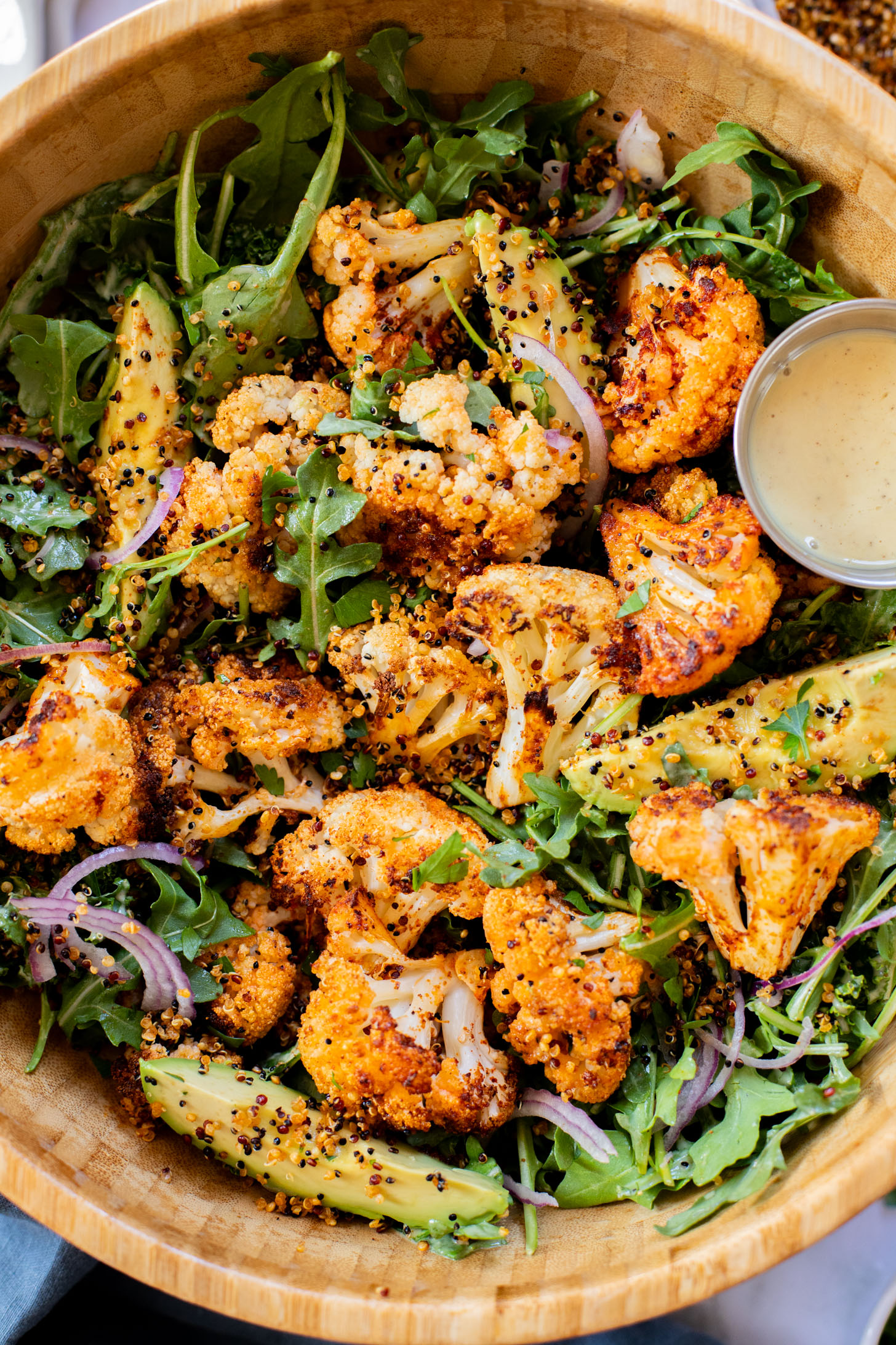 This Roasted Cauliflower Salad with Crispy Quinoa is super tasty & veggie-packed. Topped with the best vegan honey mustard dressing | ThisSavoryVegan.com
