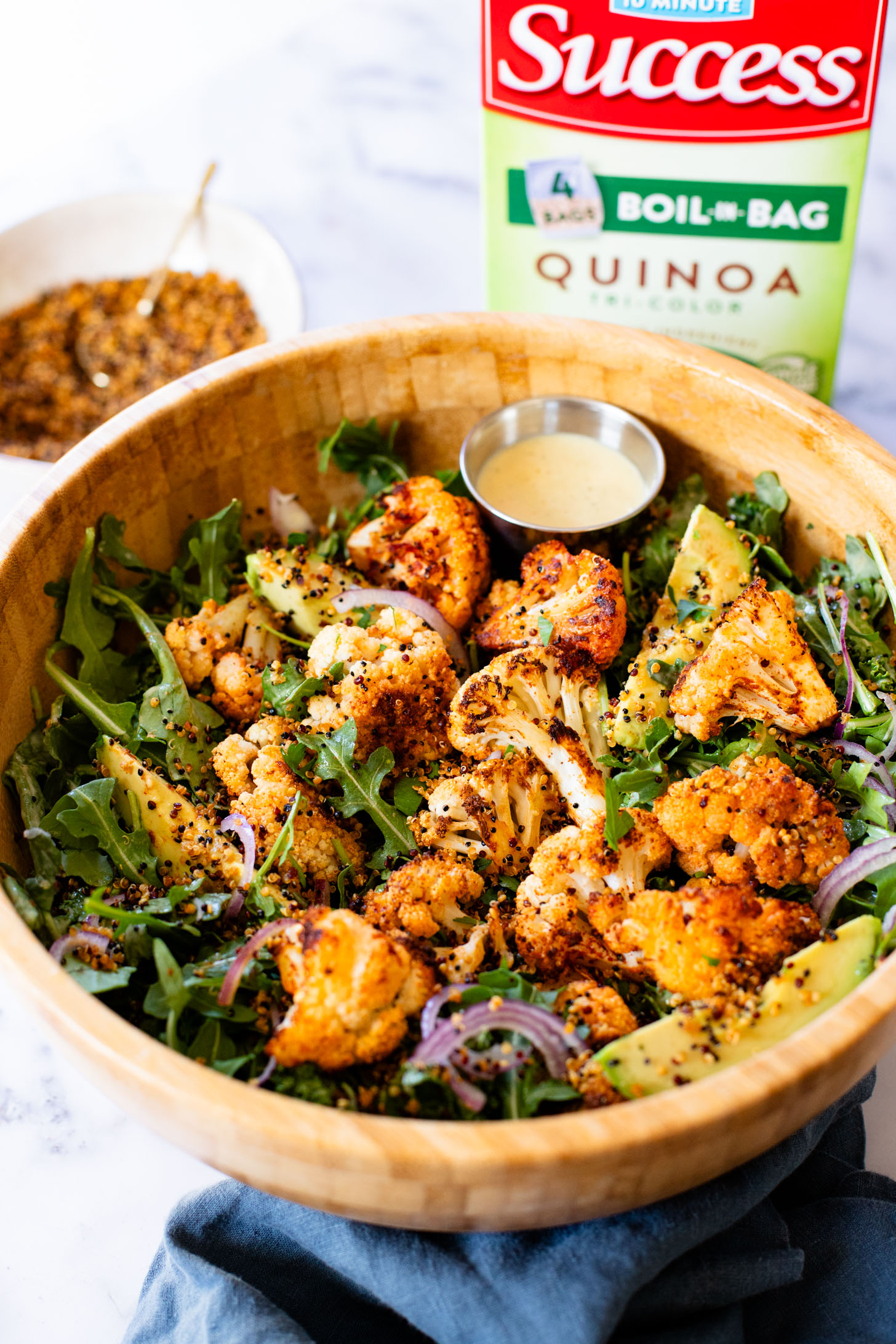 This Roasted Cauliflower Salad with Crispy Quinoa is super tasty & veggie-packed. Topped with the best vegan honey mustard dressing | ThisSavoryVegan.com