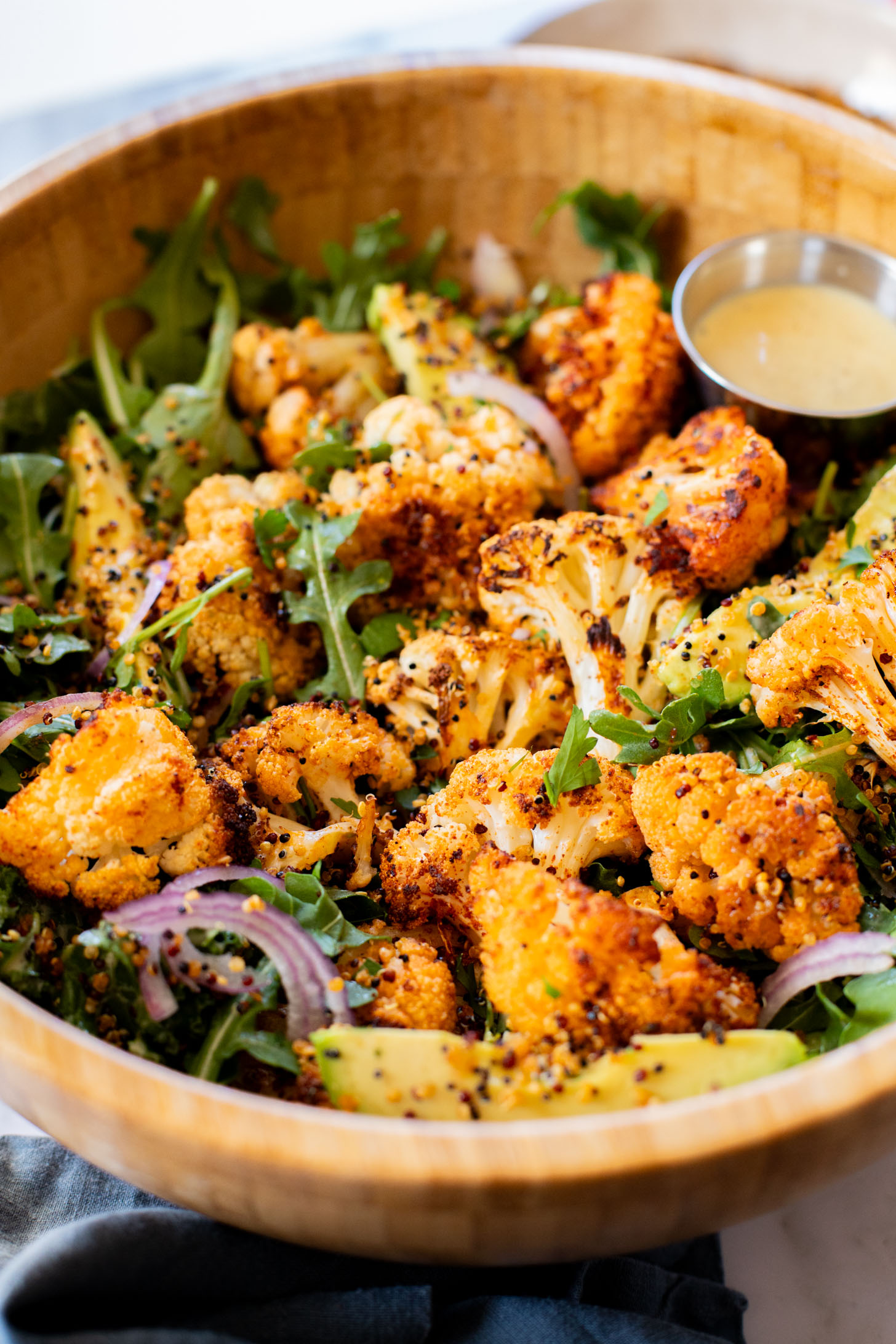 This Roasted Cauliflower Salad with Crispy Quinoa is super tasty & veggie-packed. Topped with the best vegan honey mustard dressing | ThisSavoryVegan.com