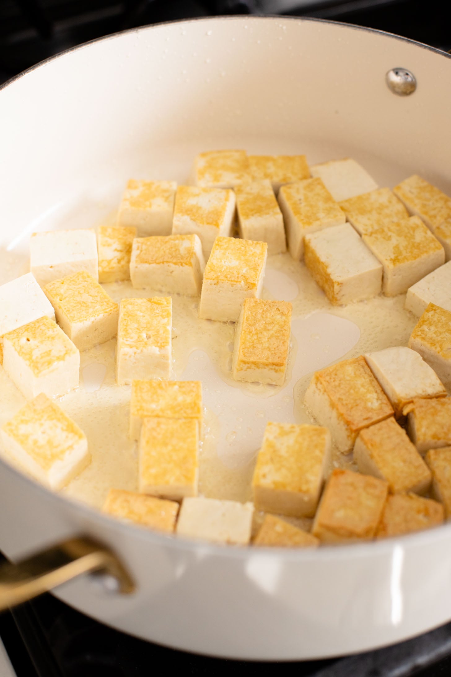 This Sticky Garlic Tofu is a simple weeknight dinner. Made with an agave garlic sauce & stir fried with broccolini | ThisSavoryVegan.com