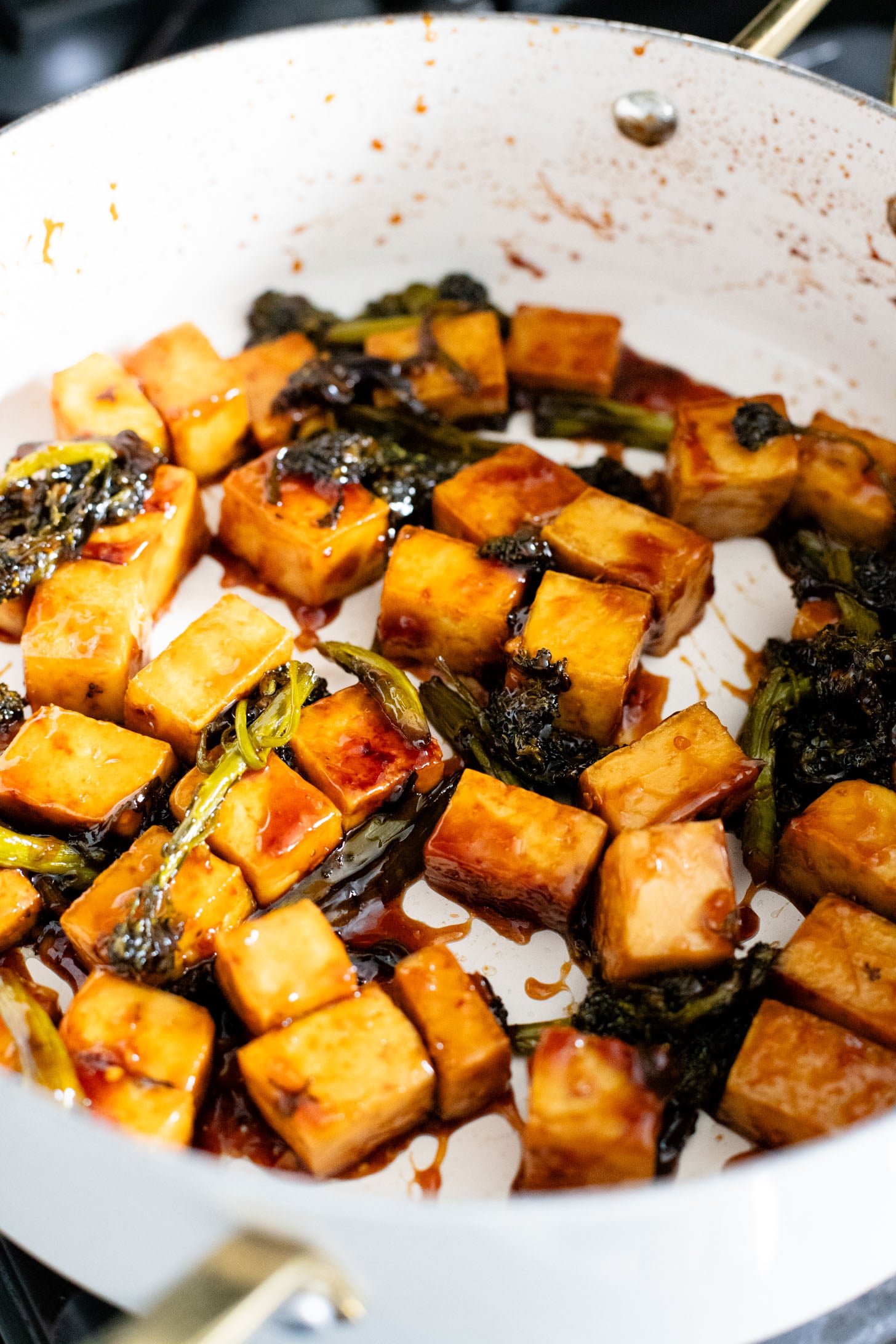 This Sticky Garlic Tofu is a simple weeknight dinner. Made with an agave garlic sauce & stir fried with broccolini | ThisSavoryVegan.com