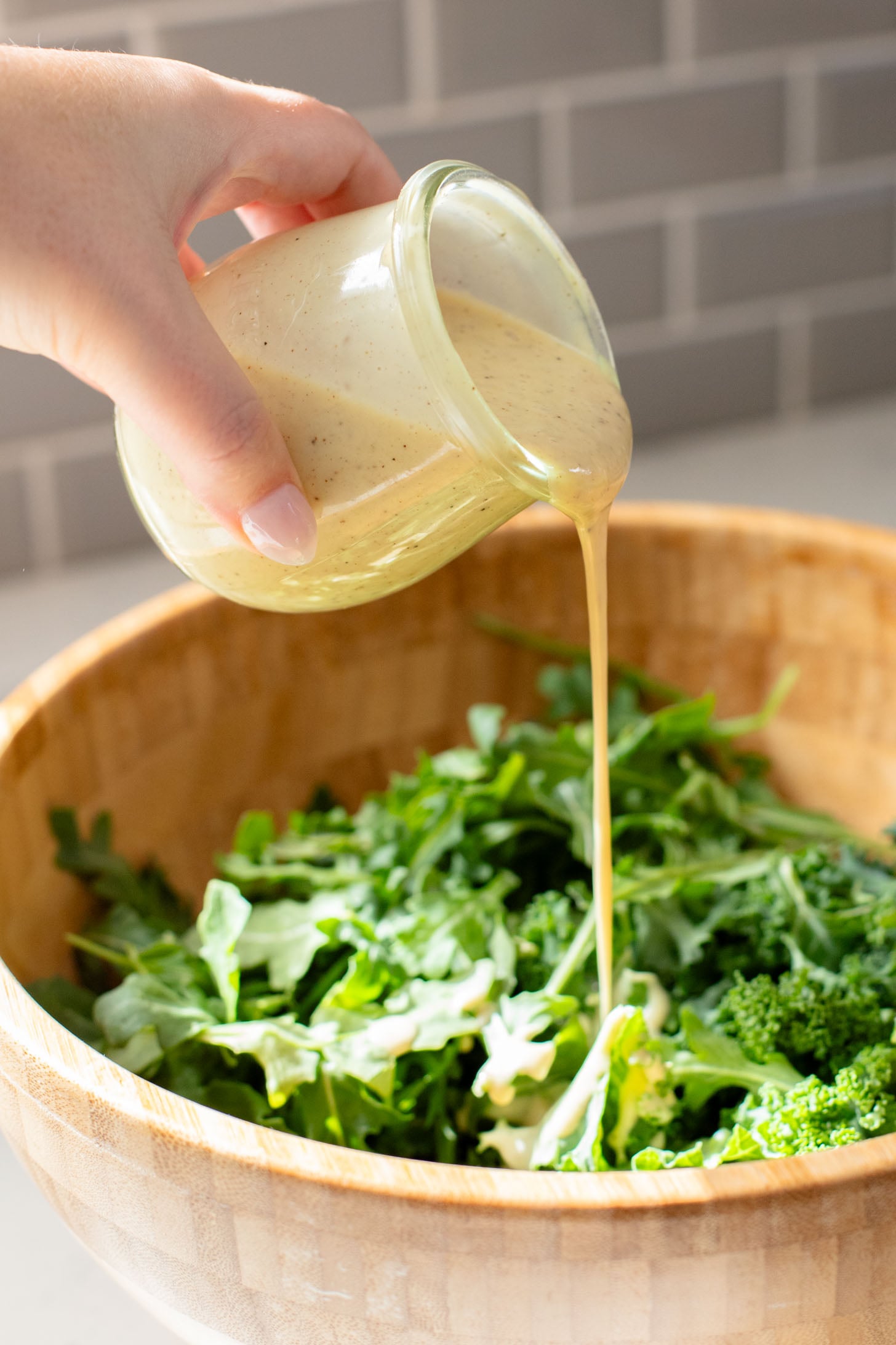 This Vegan Honey Mustard Dressing is the perfect simple & tangy dressing that can go with so many salads and wraps | ThisSavoryVegan.com