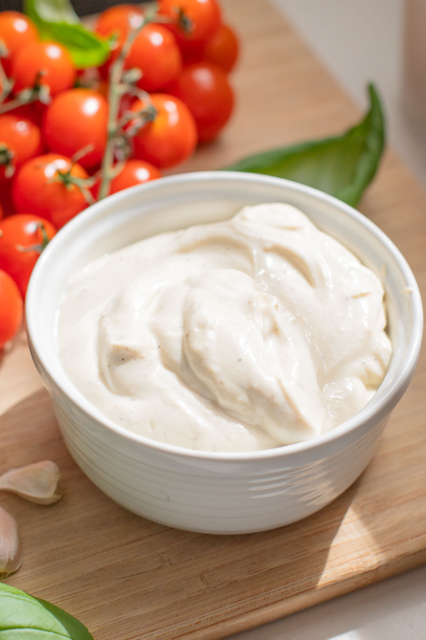 These Roasted Tomato & Ricotta Crostini are the best dairy-free appetizer! Bread slices are topped with vegan parm, tofu ricotta & burst tomatoes | ThisSavoryVegan.com