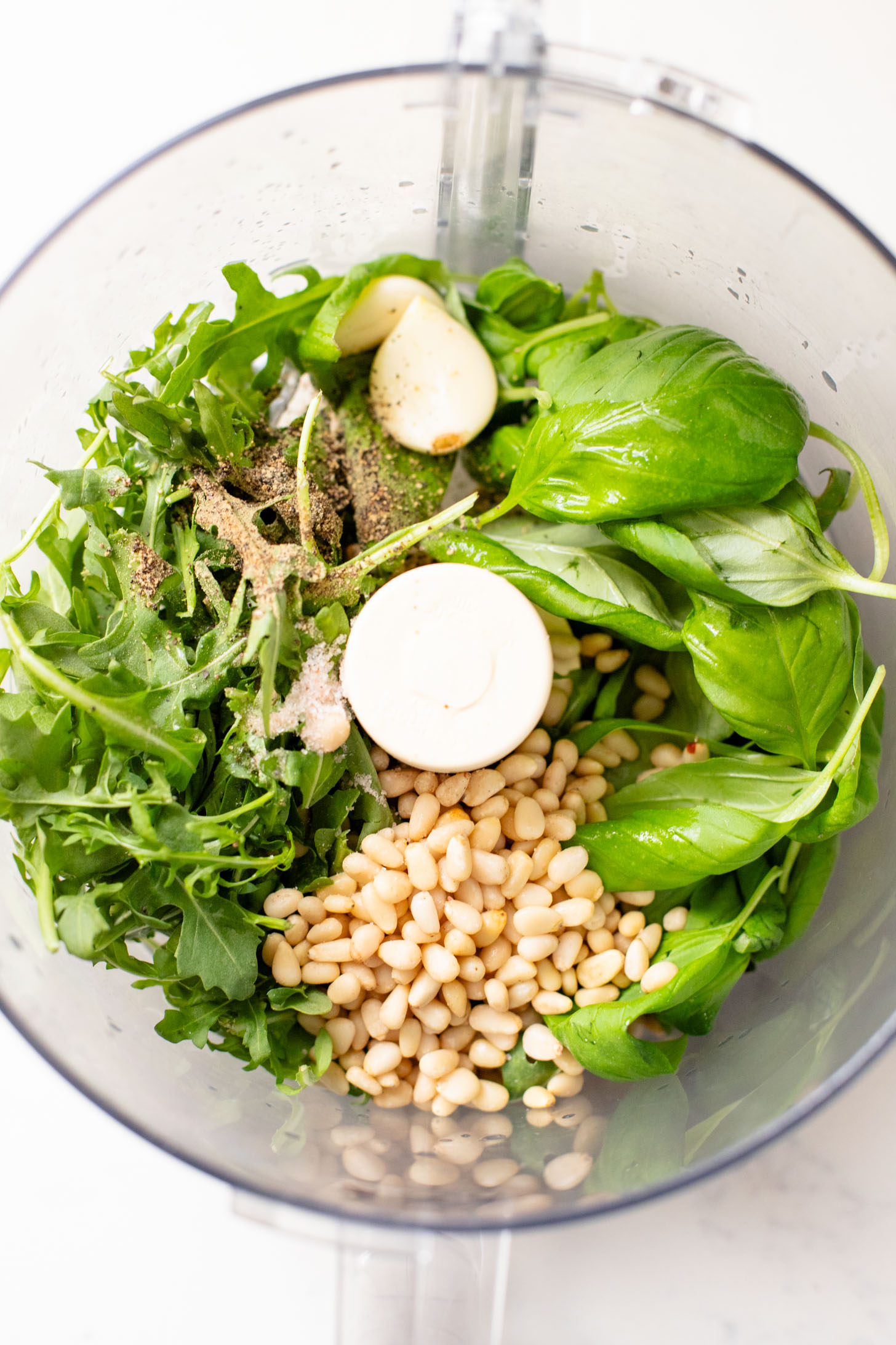 This Arugula Pesto Rigatoni is dairy-free and delicious. Arugula adds a peppery bite to the basil pesto. A quick & easy vegan dinner | ThisSavoryVegan.com