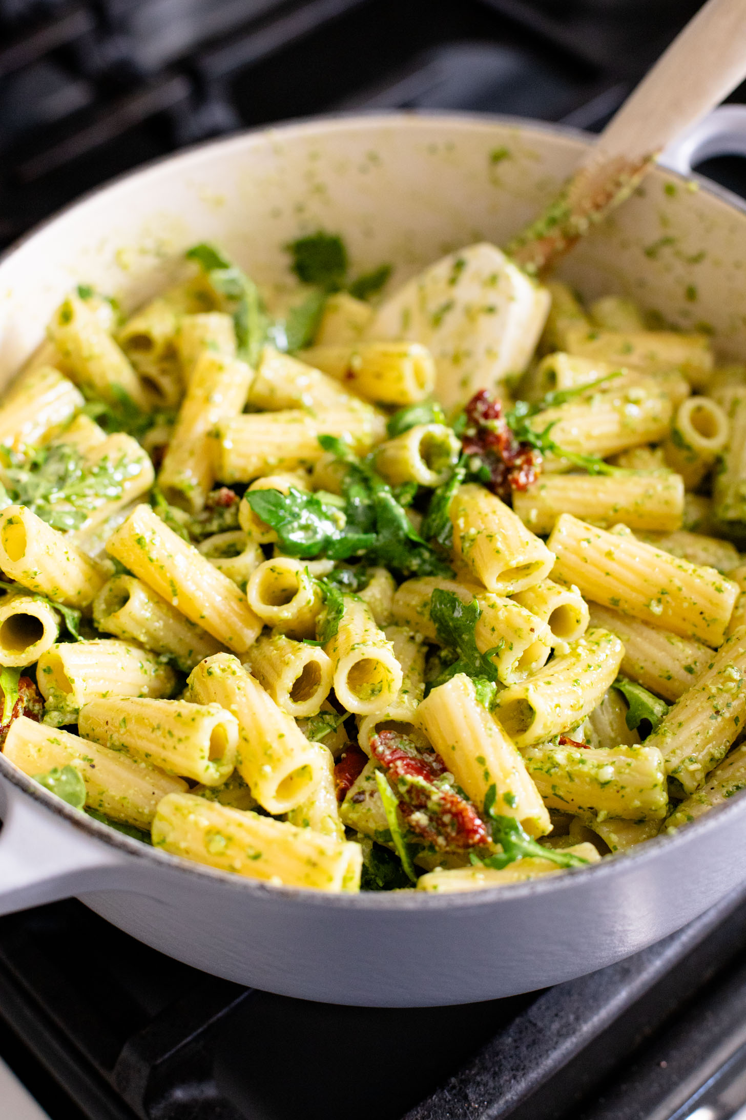 This Arugula Pesto Rigatoni is dairy-free and delicious. Arugula adds a peppery bite to the basil pesto. A quick & easy vegan dinner | ThisSavoryVegan.com
