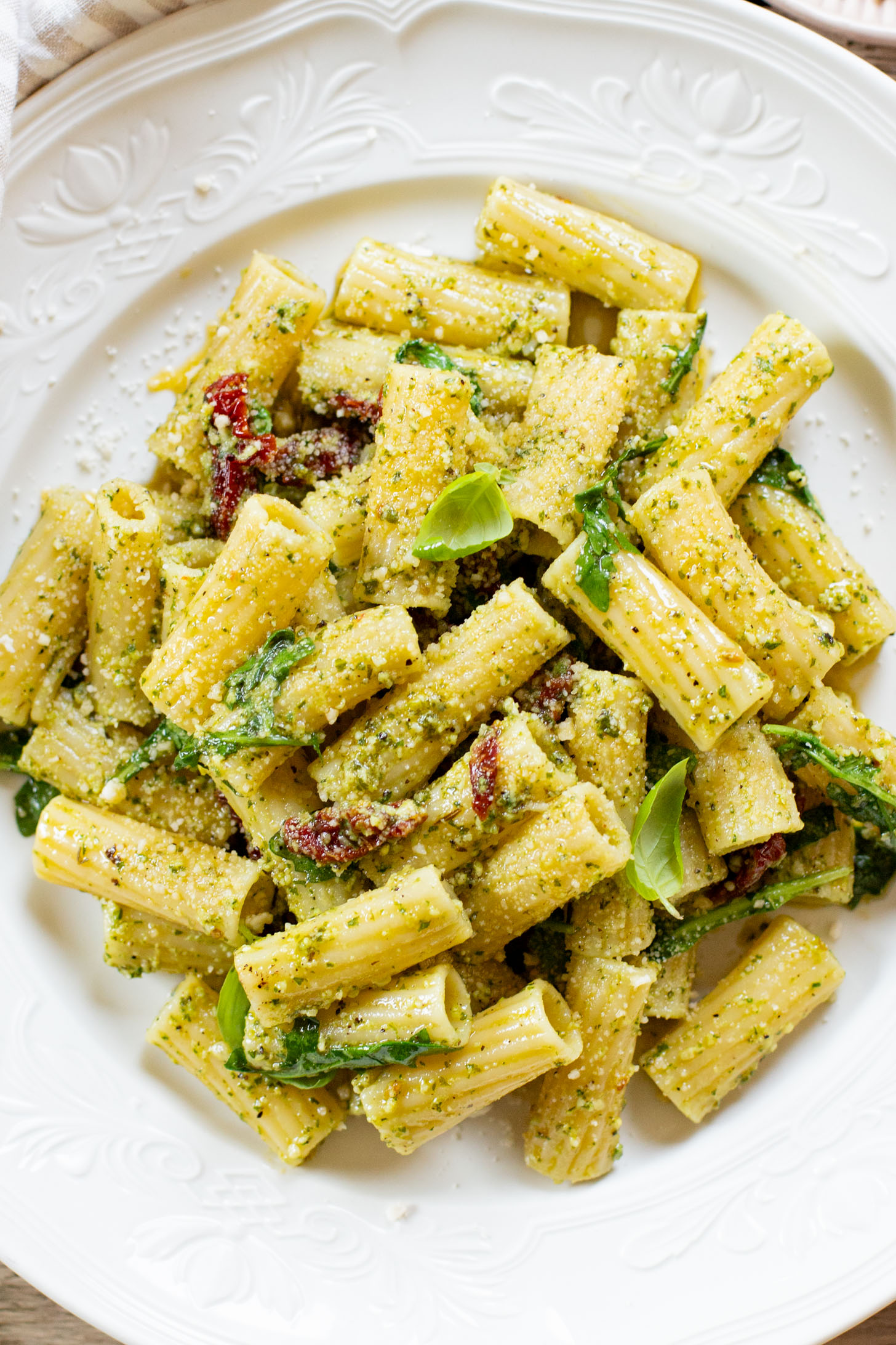 This Arugula Pesto Rigatoni is dairy-free and delicious. Arugula adds a peppery bite to the basil pesto. A quick & easy vegan dinner | ThisSavoryVegan.com